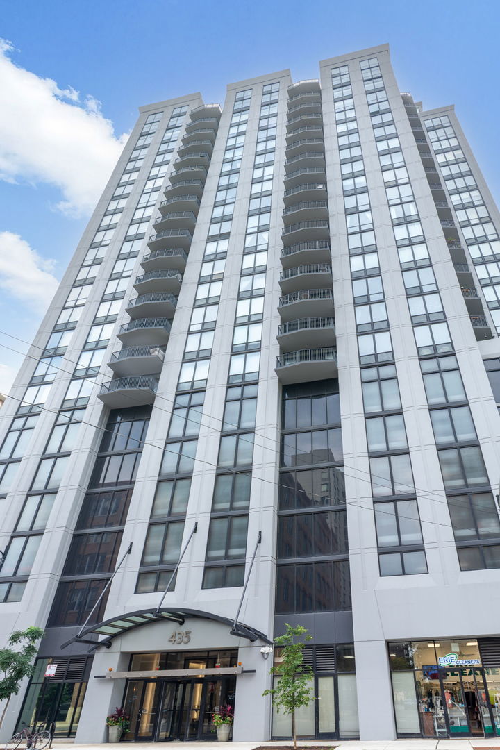 Enjoy stunning panoramic city views from floor-to-ceiling windows in the coveted southeast tier at Erie Centre.  Price includes a deeded 2-car tandem prime parking spot in the attached, heated garage! This spacious home with a desirable floor plan is flooded with natural light. The open concept living/dining room features hardwood floors a gas fireplace, and incredible views.  The updated kitchen features quartz countertops, a large island, abundant storage, and newer stainless steel appliances. The large, primary bedroom features a walk-in closet with custom wood shelving and a stunning custom marble and travertine ensuite with a soaking bubble tub and glass door steam shower.  A generously sized second bedroom with a custom-organized closet and updated bath with a walk-in shower. The hallway features spacious closets with custom wood shelving. An in-unit stackable washer/dryer and a building storage locker are also included. Erie Centre features a stylish lobby, 24/7 door staff/security, an on-site property manager and maintenance staff, fitness center, rooftop sundeck, party room, and bike room.  The prime River North location is near public transportation, coffee shops, Montgomery Park (dog-friendly), the East Bank Club, and world-class dining. A beautiful home with gorgeous views...this must be your place!