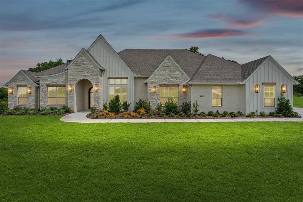Introducing this stunning single-story modified Cape May Signature floorplan offering 3,514 sq ft of thoughtfully designed living space. This home has 4 bedrooms, 3.5 bathrooms, study, game room, 4 car garage & sits on a 2 acre lot outside city limits in the Santana Ridge community. The exterior features Silverado brick, chopped limestone, board & batten siding- anchored by a 3'x8' iron front door and a 16'x8' four-panel slider on the back. Stained tongue-and-groove ceilings grace both covered porches. Inside, full arch walkthrough openings and 8-foot interior doors flow throughout. The living room showcases a flat ceiling with 4 stained pine box beams and a gas fireplace with full stone to ceiling and floating oak wrapped mantel. The rear porch offers a wood-burning fireplace with brick to ceiling and cedar mantel. The heart of the home is the kitchen with two islands, granite countertops, a 5-burner gas cooktop, double ovens, drawer microwave, dual sinks & large pantry. The large primary bedroom features a double box ceiling; the ensuite bath impresses with a vaulted ceiling, beach entry shower, freestanding soaking tub, dual vanities & DUAL walk-in closets. Open cell foam insulation, 14-SEER air conditioning, electric heat pump, and a WiFi thermostat enhance year-round comfort. Epoxy-coated garage floors, gutters, and a beautiful landscaping package complete this exceptional property. Come see it in person!