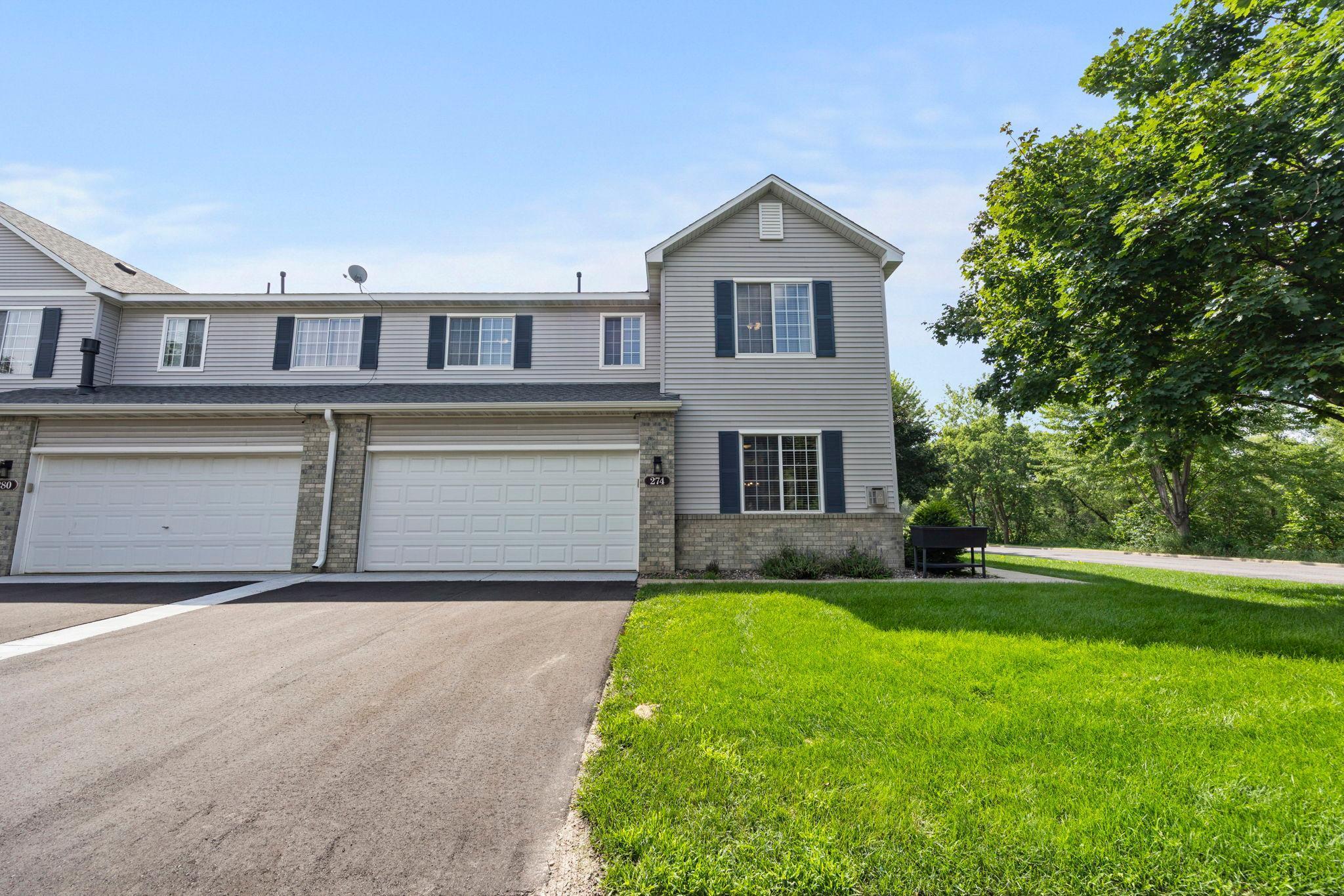 Welcome to this move-in-ready 3-bedroom, 2-bathroom end-unit townhome, perfectly positioned on a spacious corner lot for added privacy and abundant natural light. Tucked within a walkable, well-connected neighborhood near scenic parks, dining, and shopping, this home offers the perfect blend of comfort, convenience, and tranquility.Step inside to a bright and inviting main level with airy 9-foot ceilings and a modern gas fireplace anchoring the spacious living room. Plush new carpeting (2023) adds cozy appeal, while large windows bathe the space in sunlight. The open layout flows seamlessly into a dedicated dining area and a thoughtfully designed kitchen featuring sleek appliances—including a double oven—wood flooring, updated hardware (2025), and a two-tiered peninsula with breakfast bar seating. A generous walk-in pantry adds practical storage, and a nearby half bath and access to the attached 2-car garage (with built-in shelving) enhance everyday functionality.Upstairs, the primary suite boasts a large walk-in closet and access to a full bathroom with dual sinks, updated fixtures, and tiled tub/shower. Two additional bedrooms offer flexibility for guests, office, or hobby space, while the upper-level laundry—featuring new Samsung appliances—adds modern convenience.Additional highlights include an 8x10 patio, recent mechanical upgrades, new roof in 2022, and community-maintained lawn care and snow removal—ideal for low-maintenance living.