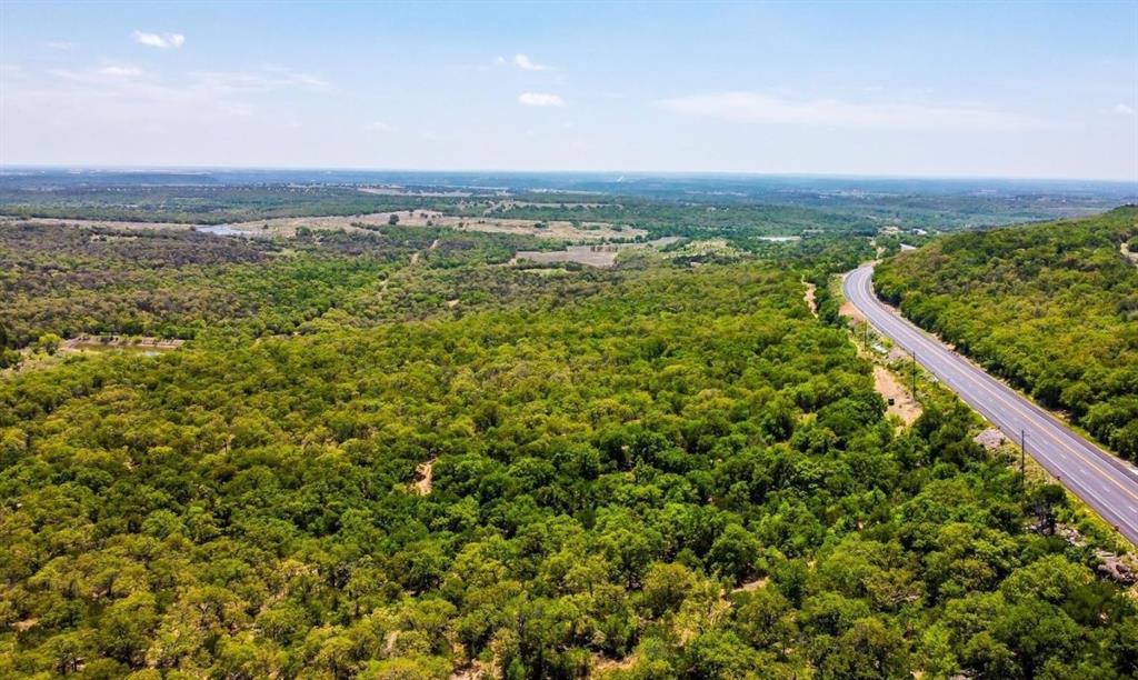 Discover a rare chance to own expansive acreage in Palo Pinto County, complete with access to Santo Water. These unique tracts offer striking elevation changes—ranging from 790 to 1,040 feet—providing sweeping, panoramic views! The landscape features mature hardwoods, scattered Junipers, impressive native boulders, and an abundance of wildlife, making it the perfect setting to build your dream home. Conveniently located on Highway 281, just minutes north of Interstate 20, this property offers both seclusion and accessibility. Available parcels in either 30, 40 or 100 acres, with select tracts including ponds, creeks, and even a large metal barn! Don’t miss out on this prime opportunity!