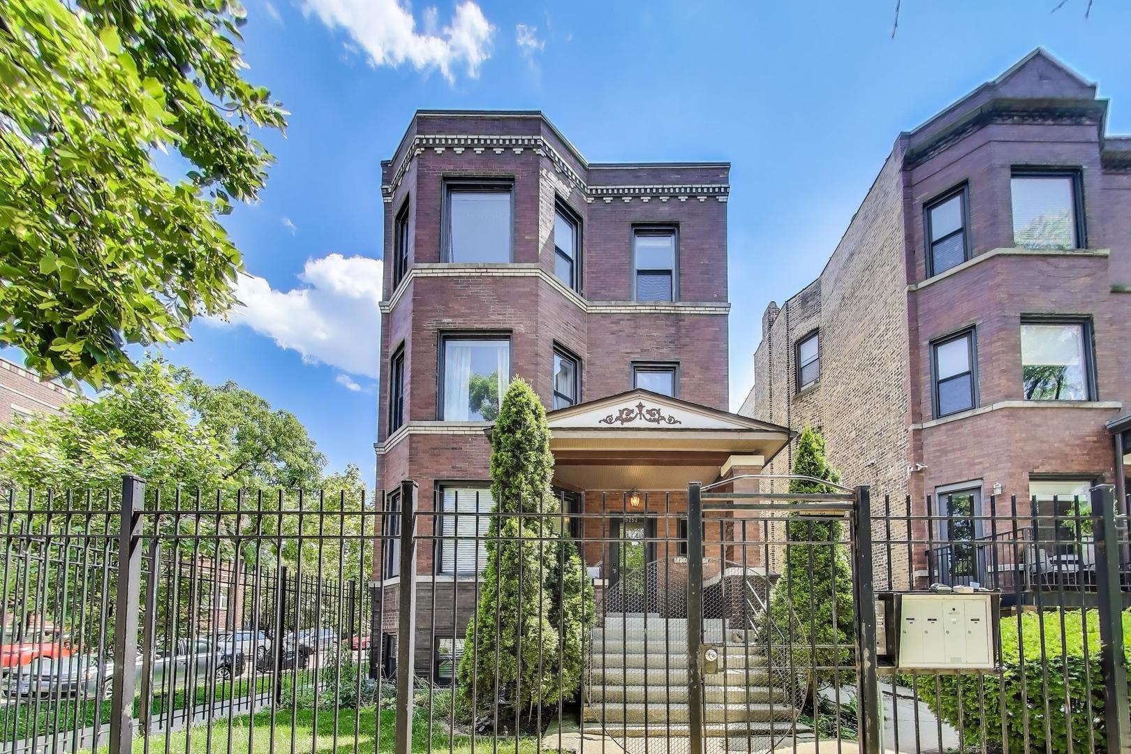 Logan Square Gem! Enjoy the best of top-floor living in this sun-drenched 2 bed, 2 bath condo located in a charming full-brick building just steps from vibrant Palmer Square. This bright and airy corner unit is a true standout, boasting walls of unobstructed windows, treetop views, and a highly desirable split-bedroom floor plan that offers both comfort and functionality. You'll love the generous living space that lives larger than expected, featuring a separate dining area, eat-in kitchen, and a unique private entrance from the second floor. The updated kitchen and baths, central heating and cooling, in-unit laundry, and ample storage make this home completely turnkey. Character abounds with hardwood floors throughout, high ceilings, crown molding, arched doorways, and a cozy wood-burning fireplace. Outdoor living is a breeze with a sizable balcony off the kitchen and shared access to a garage roof deck-perfect for entertaining or relaxing. One exterior parking space included. All this in an unbeatable Logan Square location close to parks, transit, restaurants, nightlife, and shopping. Pet-friendly!