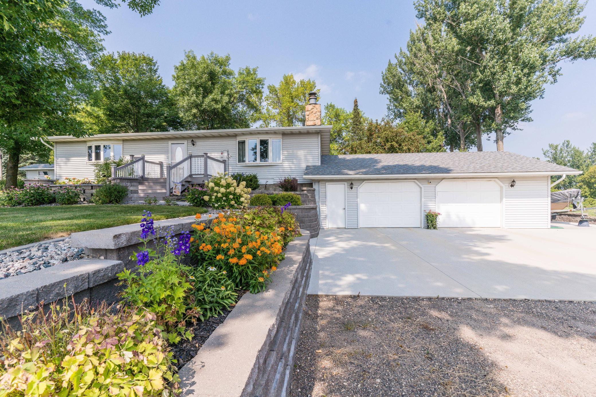 Rare 1.45 acre property just on the edge of Fergus Falls!  Get the best of both worlds with the private, country feel yet conveniently located close to all the City amenities. This one owner, well-maintained 4 bedroom, 2 bath home comes complete with beautiful, professionally installed landscaping, a low maintenance deck and paver patio, and a large back yard stamped concrete patio for outdoor enjoyment and entertainment.   Features include 2 main floor bedrooms, Cherry kitchen cabinets, a main floor full bathroom with marble countertop, gas range with electric capability, a stone wood burning fireplace, 2 lower level bedrooms, a 3/4 lower level bathroom, lower level family room, lots of storage, spacious outdoor storage shed with electricity, oversized attached 2+ stall garage, and low maintenance vinyl siding.  Recent updates include flooring, Lennox central air & furnace, gas range, landscaping, cement driveway, concrete boat/RV pad & much more listed on Improvements sheet.