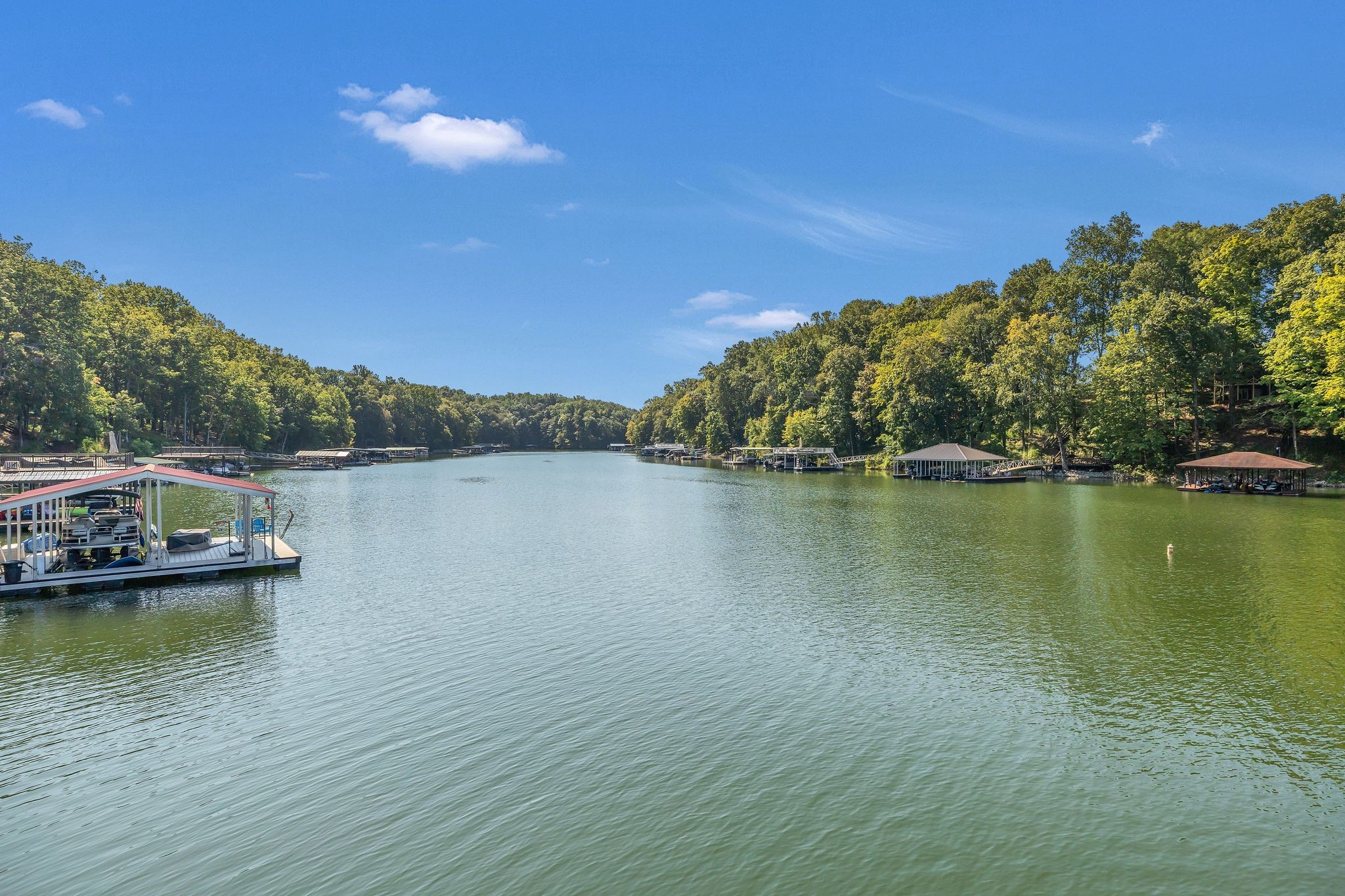 Lakefront living at its best! This beautiful brick home located in Heatherwood Sub-Div. Experience waterfront lifestyle on Tim’s Ford Lake. Featuring a double slip boat dock with a sun deck for entertaining or just relaxing in the sun. This home sells mostly furnished, Entry foyer, Kitchen/Dining Rm combo w/lots of counter & cabinet space, granite counter tops, all appliances stay, living room w/built in, gas fireplace, MBR on main level w/MBA double vanities. Extra room located basement level would make an awesome game room, etc. This property is ready for lakefront fun. Enjoy access to the lake right from your own backyard w/just a few steps. The spacious deck is perfect for relaxing or entertaining after a day on the water. Plenty of room in the 2 car-garage for boat and all your lake toys. The home offers perfect blend of relaxation and convenience on one of Tennessee’s most sought-after lakes. So come wake up every morning to the gentle shimmer of water and the sounds of nature in this beautiful lakefront home. Other rooms being used as bedrooms.