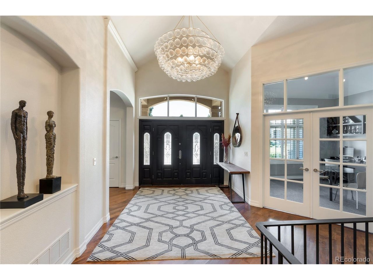 Completely remodeled single-story home. Rare HUGE 4 car garage! Step through the beautiful entry into a dramatic foyer with rich hardwood floors, soaring ceilings & sophisticated lighting. The exceptional open floor plan showcases an expansive family room anchored by a striking fireplace with a floor-to-ceiling modern facade. The chef's kitchen boasts an oversized center island, custom cabinetry and premium appliances. The breakfast nook is ideal for casual dining, while the butler's pantry connects to the elegant dining room. A private study with built-in desks and French doors creates a refined home office.The spacious main-level primary suite is a true retreat, featuring high ceilings and a luxurious 5-piece en-suite bath with bath tub, dual sinks & oversized walk-in steam shower.The impressive walk-in closet connects to the main-level laundry room. Two additional main-level bedrooms share a beautifully remodeled Jack-and-Jill bath, each with a private sink areas and generous closets.Fantastic mudroom off the side load 4-car garage.The expansive lower level offers over 3,000 square feet of space with high ceilings, a large family/rec room, media room and kitchen area with beautiful cabinetry, dishwasher, bev fridge and bar. A built-in workstation provides versatile space for studying,crafting or working from home. Two additional bedrooms feature generous closets and private sink areas, along with a three-quarter bath with walk-in shower and secondary laundry. Unfinished space provides abundant storage, flexibility and a spacious workshop. Outside, the covered patio overlooks a private, low-maintenance backyard w/new turf, full fencing, hot tub & mature trees. Additional highlights include plantation shutters and concrete tile roof.Ideally located in sought-after Lake Pointe Estates, steps from the CC State Park,this exceptional home offers sophisticated finishes & rarely offered 1-level living within Greenwood Village