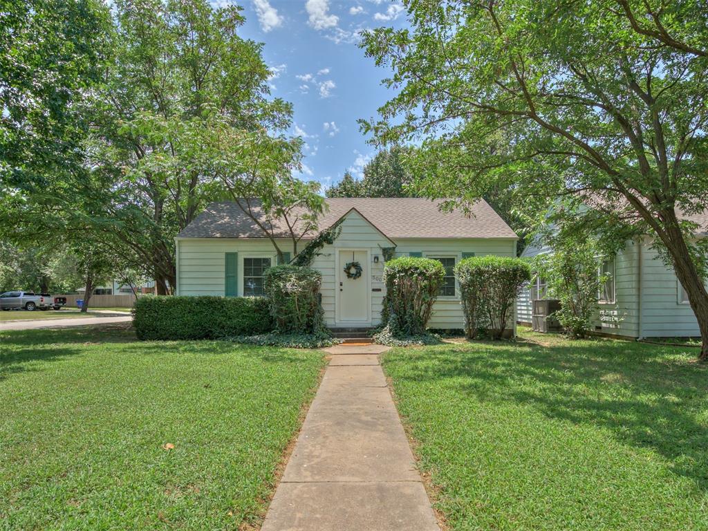 Completely remodeled move-in ready gem featuring ORIGINAL hardwood floors, a top to bottom freshly painted interior, and updated light fixtures throughout. The kitchen shines with brand new stainless steel appliances and QUARTZ countertops, offering a modern touch. Enjoy the comfort of double pane windows and a brand new bathroom designed for both style and function.  Relax year-round in the inviting sunroom that also has space for your indoor utility room, or entertain on the open deck overlooking your spacious corner lot—just steps from the vibrant Andrews Park. This home is the best blend of classic charm with contemporary upgrades.