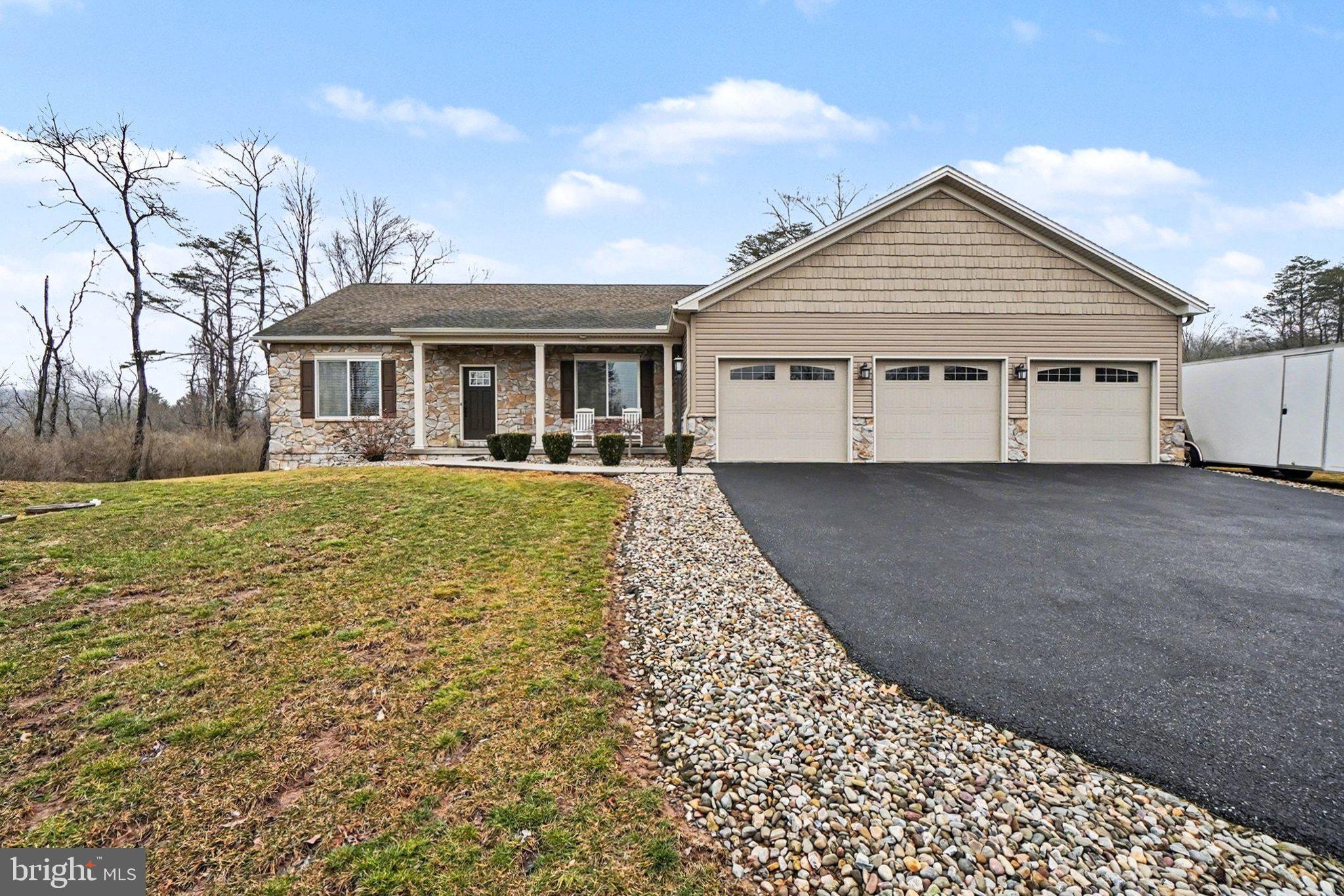 Nestled in the prestigious Aiden Grove community in Middle Paxton Township (Central Dauphin School District), this exceptional custom ranch home, constructed in 2016 by award-winning Yingst Builders, showcases unparalleled craftsmanship and sophisticated design. Spanning approximately 1,715 square feet of thoughtfully designed living space, situated on 2 acres, the home offers spacious rooms, 3 bedrooms, 2.5 bathrooms, a full basement, and a 3-car attached garage—delivering everything discerning buyers expect and more. Step through the light-filled formal entry to discover an inviting blend of modern and contemporary elegance. The open main level is perfect for gatherings, highlighted by a gourmet kitchen featuring a center island with breakfast bar, rich wood cabinetry, granite countertops, tile backsplash, premium appliances, a convenient pantry, dining area, and direct access to a sprawling composite deck. The deck overlooks serene endless mountain views, a fenced rear yard, and a large shed with full-size garage door—ideal for outdoor enjoyment and storage. The expansive great room impresses with soaring cathedral ceilings, abundant natural light from windows, and the cozy ambiance of a stone gas fireplace. The main-floor primary suite provides a private retreat with a generous walk-in closet, and an en-suite bathroom boasting a comfort-height double vanity, large mirror with lighting, and a luxurious low-profile step-in shower with elegant ceramic tile surround. Two additional spacious bedrooms with ample closets share a full hall bath with tub/shower combination. A practical main-level laundry/mudroom—complete with sink and commode—connects seamlessly to the impressive 3-car garage. The large full basement, with high ceilings, concrete floors, windows, an egress window, steps leading outside offers excellent potential for future living space, recreation, or ample storage. With seamless indoor-outdoor flow, a generous 2-acre level lot, breathtaking mountain vistas, and a prime location, this warm and character-filled home is truly a great place to call home! Schedule your private showing today.