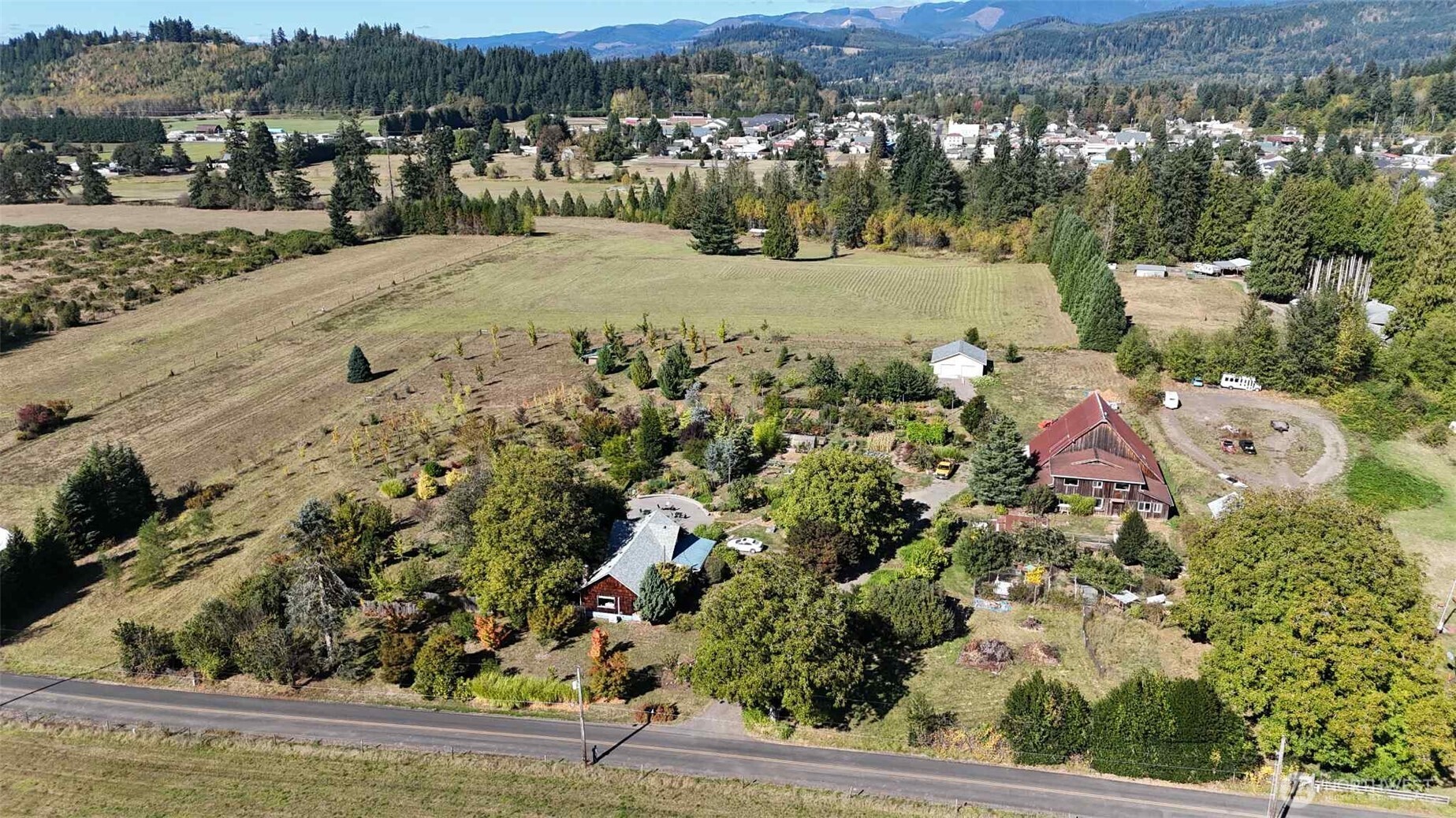 Practicing organic fruit and vegetable farm on 5 acres with a 1940's farm house, complete with basement for storing canned goods. See the "fruits" of your labor here, 3 nut trees, 13 variety of berries including red, yellow, black rasp, strawberry, blackberries, gooseberries, blueberries, elderberry, lignon berries and cherries. 7 varieties of Plum, 2 pears and 2 Asian pear trees. GRAPES for table and wine! Asparagus beds, garlic, horseradish, all the annual vegetables can name are here and thriving. The chickens have a villa! Multiple coops, seperate yards and happy birds.Enjoy the extra large patio with a view of the cozy shaded arbor, the private back deck of the main bedroom or the potters art studio,maybe a woodworker?More info