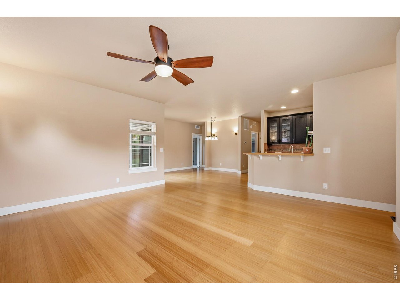 Don't miss this highly desirable bungalow-style ranch nestled in the popular Bucking Horse neighborhood! Boasting 3 bedrooms, 2 bathrooms, and a beautifully finished basement, this residence offers the perfect blend of style and function. Inside, you'll love the seamless open floor plan highlighted by warm wood floors, elegant countertops, and sleek stainless-steel appliances. The primary suite serves as a private retreat, complete with a luxurious 5-piece bath and a spacious walk-in closet. Outside, the meticulously detailed landscaping and a rare, oversized 3-car garage truly set this property apart. All this, located just blocks away from the vibrant Jessup Farm Artisan Village, local shops, and dining!