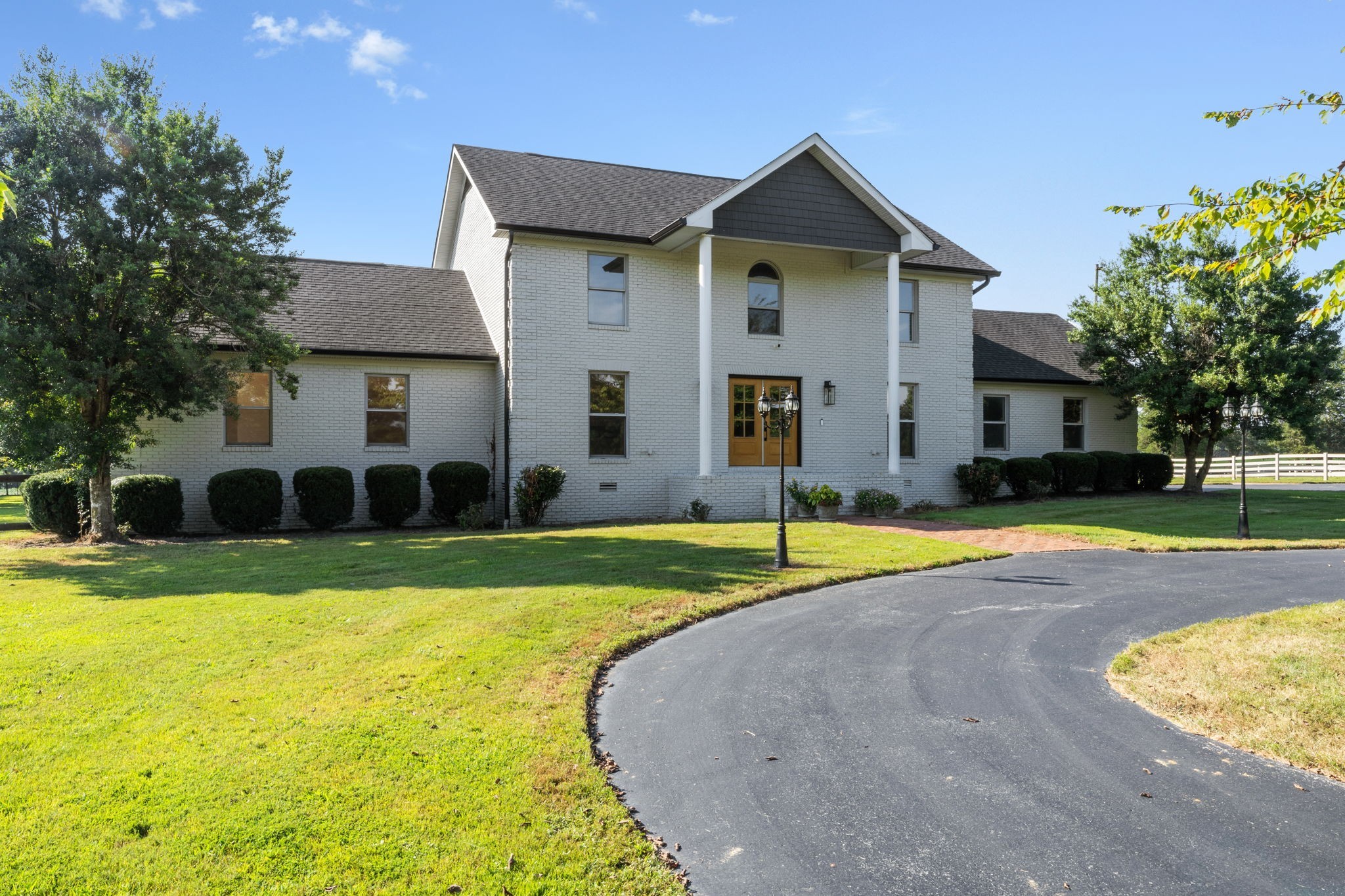 Discover the rare opportunity of owning this completely renovated 7.2 acre exceptional estate at 3935 Harmony Grove Road in picturesque Hopkinsville, KY. Your dream country retreat just a short drive to Hopkinsville or Lake Barkley, you can't beat this location! Walking in from the covered front porch you are greeted with an entry foyer leading to a vast open floor plan with exquisite views from every window. Encompassing approximately 3,440 square feet, this home is refined with top tier craftsmanship and modern luxury design. Featuring 5 spacious bedrooms and 3 luxurious bathrooms, it offers both space and style. Step into the gourmet kitchen, a chef's dream with designer lighting, custom cabinets, tile backsplash, granite countertops, farmhouse sink, a 6-burner gas range, double ovens and an expansive island complete with top-of-the-line stainless steel appliances. The open layout seamlessly connects to a living area adorned with an oversized fireplace and gleaming, sanded and finished hardwood floors. Retreat to the primary suite offering an expansive double walk-in closets, a stunningly renovated bathroom with dual vanity, separate freestanding bathtub and a beautifully tiled shower with frameless glass door, along with access to private deck vistas of the stunning 16 x 32 in-ground pool. The property boasts additional indulgences including a spacious utility room and tankless water heater. Spread across a generous 7 acres, the estate features four-board fencing ideally suited for horses, livestock, or farming with a picturesque pond, a barn with four stalls, and a five-bay utility shed. Enjoy the convenience of a long circular driveway, ample parking and a two car garage. Whether entertaining or relaxing, this home is a sanctuary where every detail has been thoughtfully designed to offer the very best in luxury living. This private estate is truly one of a kind in every way. Don't miss the opportunity to own a piece of paradise in the heart of Southwestern KY.