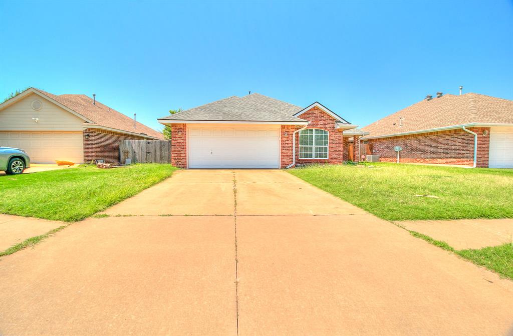 Well-maintained brick home offering an open floor plan with updated wood-look flooring throughout the main living areas. Large office or bonus space that could be used as a playroom. The spacious living room features a corner fireplace and large window for natural light, flowing directly into the dining area and kitchen. The kitchen includes a breakfast bar, ample cabinet space, and direct access to the dining area for easy entertaining. The primary suite offers privacy and comfort with an attached bathroom and walk-in closet. Additional bedrooms are well-sized and share a full bathroom. A dedicated laundry room adds convenience.  Step outside to a fenced backyard with a covered pergola deck—perfect for outdoor dining or relaxing—and a fire pit area. The property also features a two-car garage and a driveway with plenty of parking space. Located in a quiet neighborhood close to schools, shopping, and major roadways, this home combines comfort, function, and convenience.