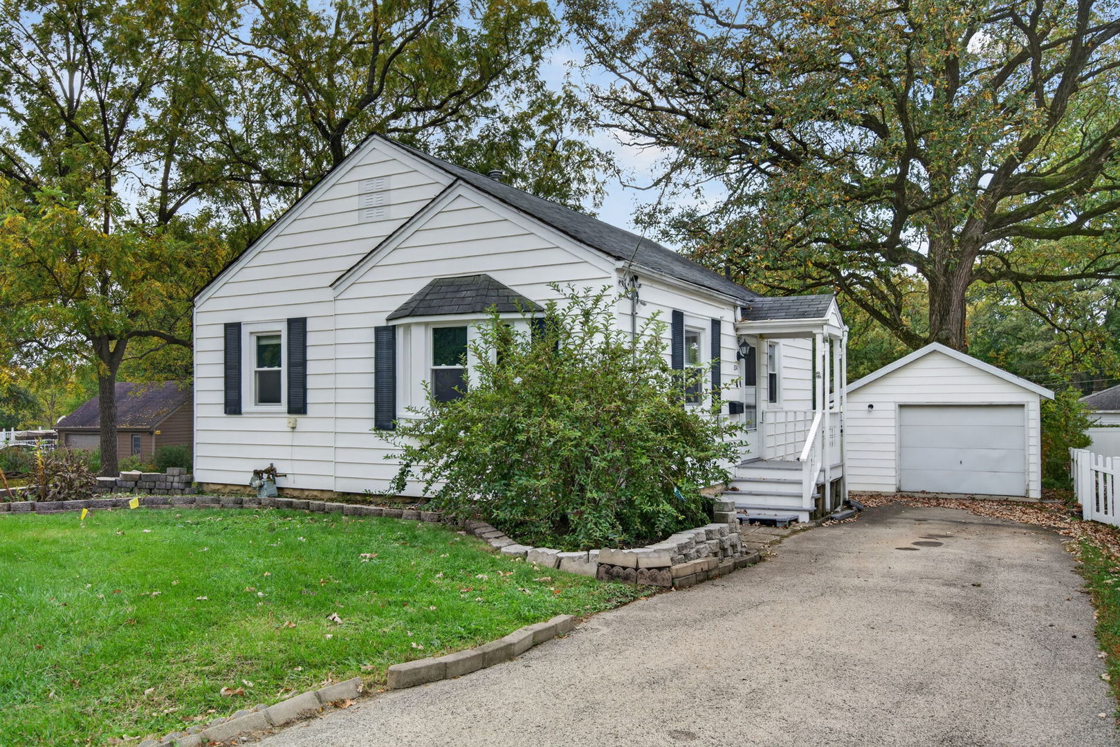 Charming, cozy, and full of character! This delightful two-bedroom home in New Lenox offers the perfect blend of original charm and comfortable living. Step inside to find beautiful original woodwork, timeless interior doors with glass doorknobs, and a welcoming living room featuring a lovely bay window that fills the space with natural light. New windows installed in 2025 add a wonderful update while preserving the home's classic appeal. Both bedrooms and the living room feature ceiling fans, while the bathroom offers a beautifully tiled shower. Enjoy your morning coffee or unwind in the screened-in sunroom overlooking the beautiful yard. A one-car detached garage adds convenience and extra storage. Nestled in a wonderful neighborhood and conveniently located near the train station, this home offers small-town charm with easy access to commuter transportation. Great things really do come in small packages!