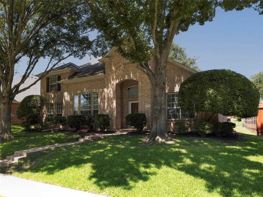 Upon entering the foyer attention is drawn to the vaulted ceilings, chandeliers, wood flooring and majestic staircase. Passing through the archway is a flex space, currently used as a study and dining room complete with crown molding, chair rail and windows that stream light from the front yard. Leading to the Great Room that offers a brick, gas starter fireplace, wall of windows, to see the entire back yard and a view of the eat-in kitchen. Entertaining will be easy with the open concept and plenty of room to make guest feel comfortable. The kitchen has a walk in pantry, gas cooktop, stainless steel dishwasher, granite counter tops, tile backsplash and strategically placed island with 2 electrical outlets. Not only is the Primary bedroom with walk in closet, ceiling fan and ensuite downstairs there is also a 2nd bedroom and another full bath downstairs. Walking upstairs are 2 more bedrooms each with a walk in closet and ceiling fan, another full bath and a game room with a balcony. The laundry room is downstairs and leads to the garage. Parking is in the back. Outside the back yard offers a covered patio, gas grill, sink and refrigerator. A large tree covers most of the back yard giving plenty of shade for outside activities. This home is close to schools, major highways, restaurants and shopping.