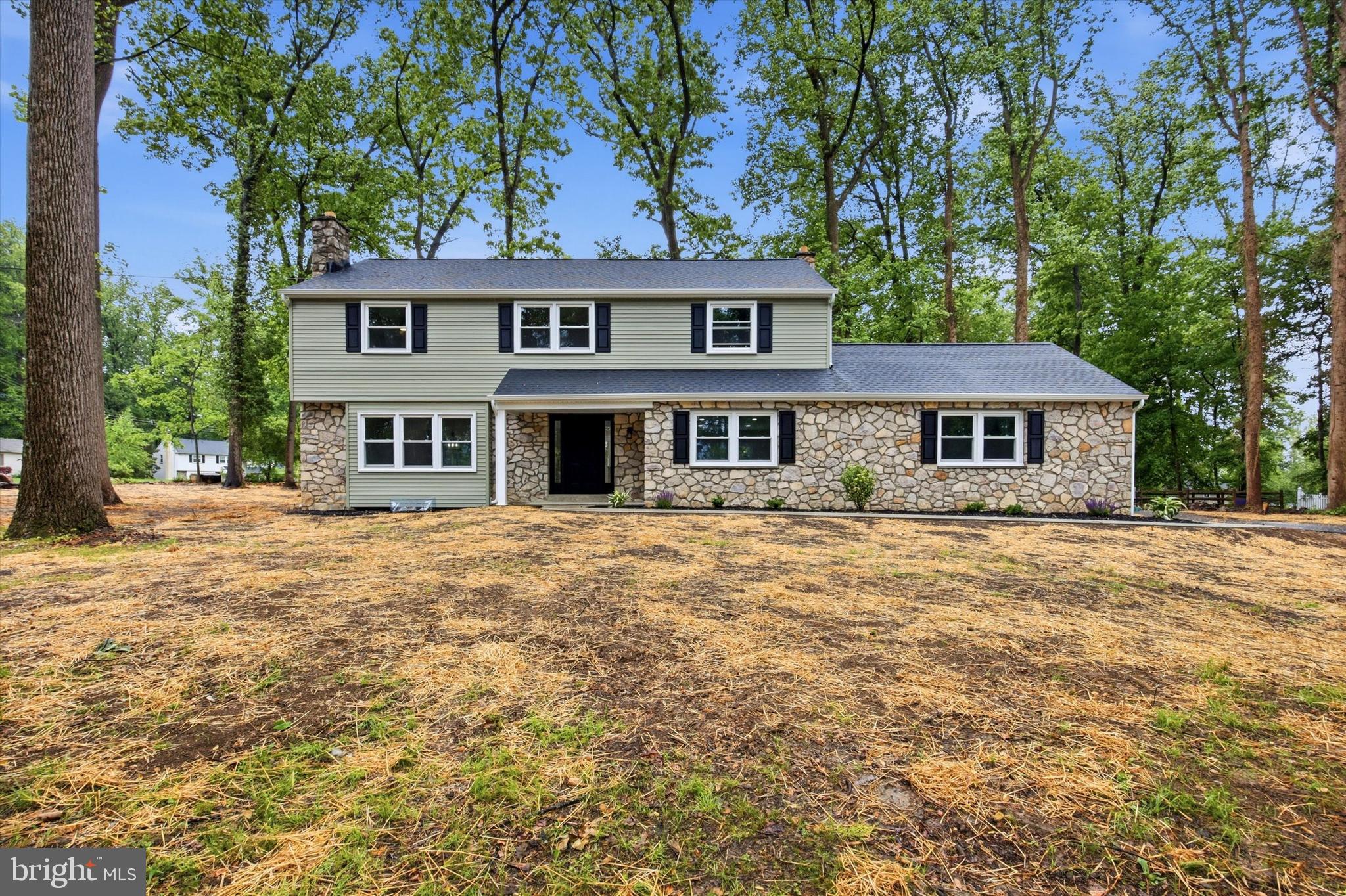 Welcome to 578 Westwood Drive — a fully renovated, modern home located in the highly sought-after Downingtown East School District! This 4-bedroom, 2.5-bathroom property has been extensively updated and thoughtfully improved throughout, offering buyers peace of mind with major upgrades already completed including a new roof, new windows, new HVAC system, and new driveway. Enter into the home with neutral warm tones throughout and luxury vinyl plank flooring spanning much of the first floor. The beautifully renovated kitchen features white shaker cabinetry, white quartz countertops, stainless steel appliances, a glazed tile backsplash, recessed lighting, and stylish gold fixtures accented by black and gold drawer pulls. A corner peninsula with seating overhang and shiplap backing opens seamlessly into the eat-in dining area highlighted by a modern centered chandelier. The front living room is flooded with natural sunlight from three oversized front windows, while the sunken family room offers a stunning fieldstone fireplace and sliding glass doors leading to the rear patio. A private powder room with a modern vanity and a convenient mudroom/laundry room combo with wash sink and storage complete the first floor. Upstairs, you’ll find four spacious bedrooms with refinished hardwood flooring throughout. The expansive primary suite features a beautifully updated ensuite bathroom with modern vanity, tile flooring, and a walk-in tile shower with gold fixtures. A neutral modern hall bathroom services the remaining three bedrooms. The unfinished basement is ready for your finishing touches and provides endless possibilities for additional living space, recreation, or storage. Outside, enjoy the large poured concrete patio complete with fixture for a swing — perfect for relaxing or entertaining.