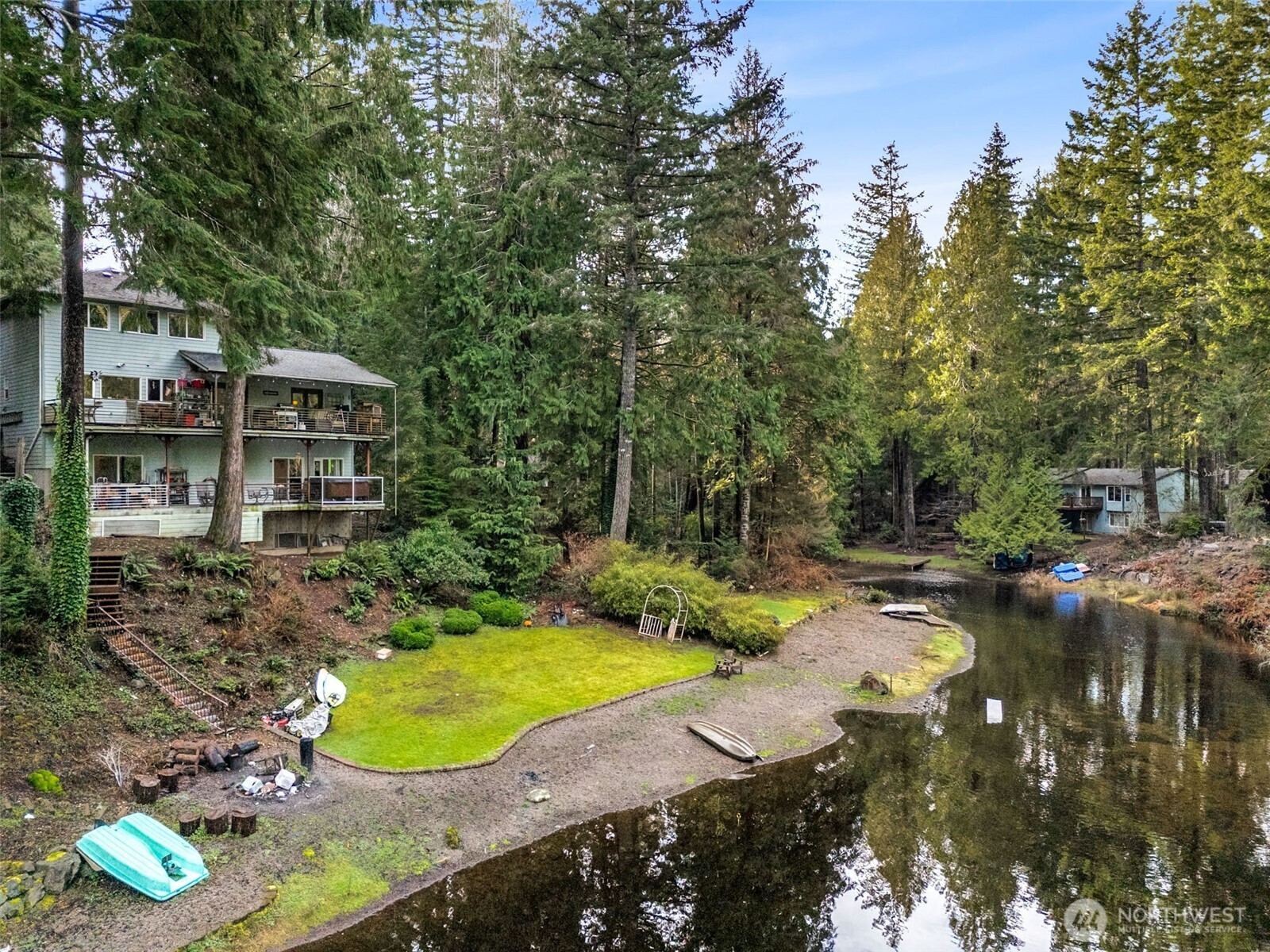 Beautiful custom built home situated on the quiet end of the lake with panoramic views! Don't miss this unique property with 2782 square feet of living space, 95 feet of waterfront, and a bedroom/bath on each level! The main floor features a large chefs kitchen with granite countertops, ample cabinetry, a gas range, and lake views from the kitchen sink. The upstairs features a large primary bedroom with an en suite, walk-in closet, and a top notch view down the channel. On the lower level, you'll find a large bonus space/game room with a wet bar, bedroom/bathroom, and deck w/ a hot tub! Plenty of natural light throughout. Entertain on the 2 spacious decks that run the length of the home or get cozy by the 2 gas fireplaces. Down on the water side there is a gorgeous beach area with a fire pit & large yard to spread out in. Enjoy kayaking, paddle boarding, boating, and fishing, right from your backyard! You'll love listening to the flow of Cranberry Creek & watching the abundance of wildlife from any area of the home. Plenty of parking space in the paved driveway with an additional paved parking area for a RV, trailer, or boat. There is a large shed for Lake toys or storage. Conveniently located close by to the clubhouse, golf course, lakefront restaurant, athletic courts, & many other amazing community amenities that Lake Limerick offers! There are multiple parks around the neighborhood with boat, launches, swimming areas, walking paths, and docks. Hurry before summer is here!
