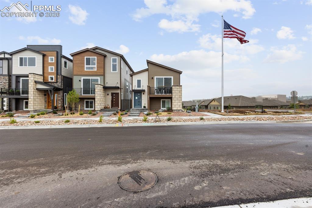 Ready now! The 220A is a 2-story urban style home with 2 car garage in the Midtown Collection at Greenways. Used as a builder model.  2 bedroom, 2 bath home. Kitchen features white painted cabinets and granite countertops, stainless appliances including a gas range and refrigerator. Primary bedroom conveniently tucked behind the kitchen. Additional bedroom and bath located privately away from the main level. Deck off of living room perfect for grilling or relaxing. Home comes equipped with air conditioning and smart home package. Landscaping included.  Home is located in a covenant protected community.  Seller incentives available.