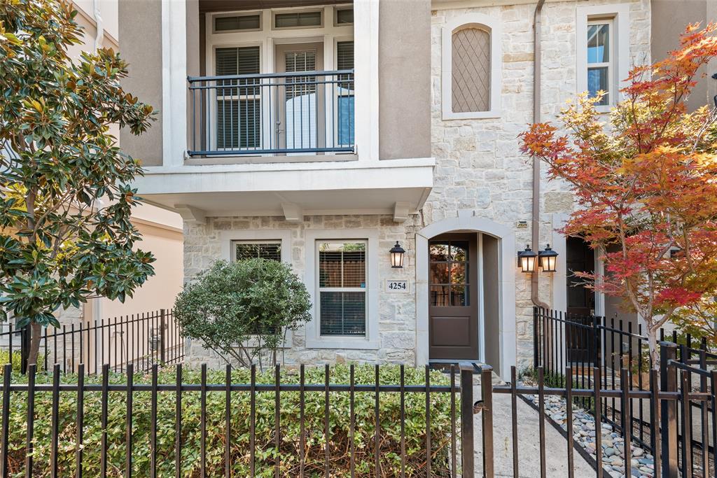 Welcome to this beautiful David Weekly build! This three-story townhome beauty offers modern elegance, abundant natural light, and an open-concept design perfect for both everyday living and entertaining.

The inviting entryway leads to a spacious living area with rich hardwood floors, high ceilings, and large windows. The gourmet kitchen boasts granite countertops, a large island with pendant lighting, stainless steel appliances, a gas range, and a stylish tile backsplash. Adjacent dining and living areas create a seamless flow for gatherings. Upstairs, the luxurious primary suite features a generous walk-in closet with custom shelving and a spa-like ensuite bath complete with a soaking tub, separate glass-enclosed shower, dual vanities, and sleek finishes. All bedrooms feature their own ensuite bathrooms, ensuring comfort and privacy for everyone, while a half bath on the second floor offers added convenience for guests. There is one bedroom downstairs for added convenience of an office, flex space, or guest bedroom. There is a balcony to provide charming outdoor retreats, and the private fenced front yard adds extra curb appeal. For added convenience, the home comes equipped with a refrigerator, washer, and dryer—making move-in a breeze. Additional highlights include a mudroom with built-in storage, a dedicated laundry room, and a two-car garage. The community features controlled access for privacy and security.

Ideally located near Dallas best shopping, dining, and major highways, this home combines comfort, style, and convenience in one exceptional package! Come take a look today!