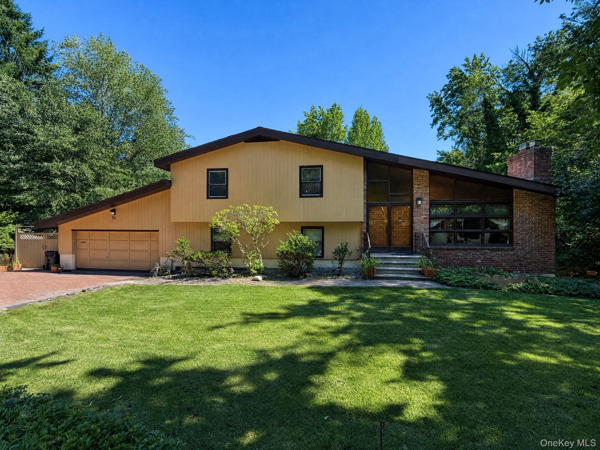 Discover incredible space and rare features in this unique property. This home offers 4 bedrooms and 2 bathrooms (3 bdrms/1 bathrm upstairs and 1 bedroom/1 bathrm downstairs in the in-law suite), making it perfect for multi-generational living, guests, or a private home office. Situated on an oversized lot that stands out for the neighborhood, the outdoor space is built for entertainment. Enjoy hot summer days by your private, inground pool, or relax under the large covered eating area right next to the water. The property also features a attached 2-car garage and an expansive driveway with parking for multiple vehicles or recreational equipment.Bring your toolbox and your design ideas to maximize this property's true value. With its unmatched footprint, functional layout, and premier outdoor amenities, this home is a diamond in the rough waiting for the right buyer to unlock its full potential. Sold as-is.