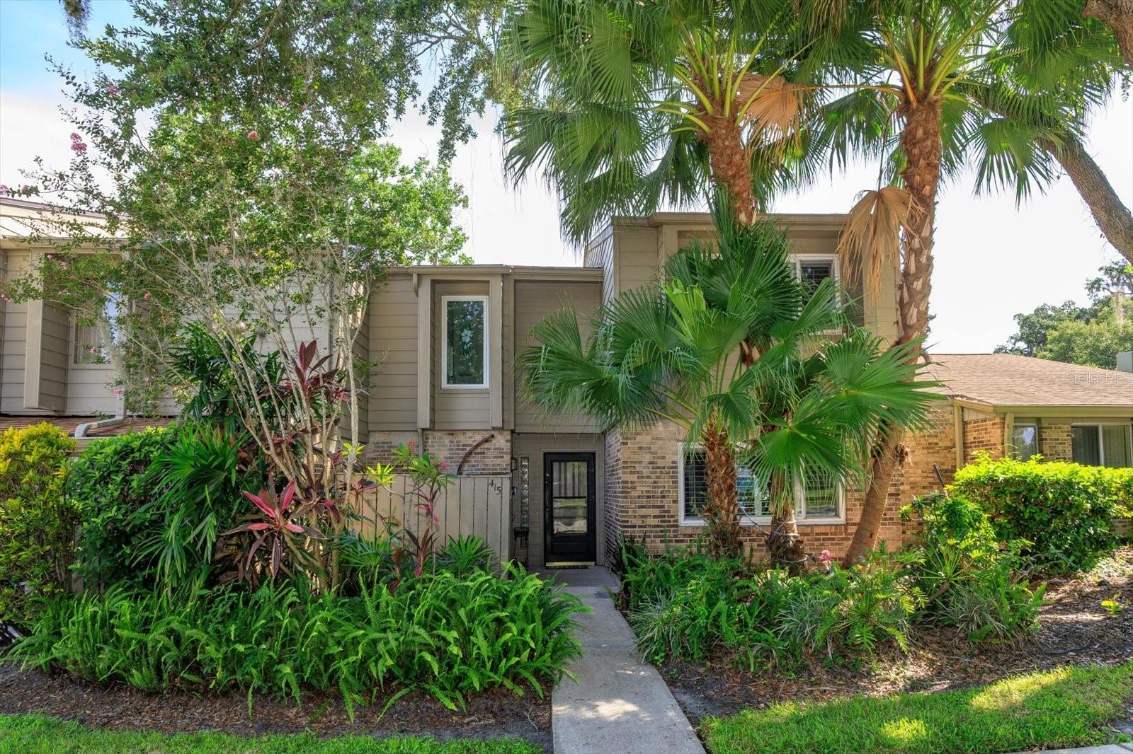 LUXURY LAKESIDE LIVING IN ALTAMONTE SPRINGS - Discover this hidden gem in a sought-after gated lakefront community, offering the perfect blend of comfort, style, and functionality - AND LAKE VIEWS.  This stunning 3-bedroom, 2-bathroom condo features a thoughtfully designed floor plan with soaring ceilings, oversized windows, and modern upgrades throughout.  The main level boasts a PRIVATE GUEST SUITE WITH DELUXE FULL BATH and luxury wood vinyl flooring—perfect for visitors or a mother-in-law suite. The open concept living and dining area is bathed in natural light and framed by treetop and sky views through dramatic upper windows. Overlooking the space is a stylish and spacious GLASS-ENCASED LOFT, ideal as a DEN, STUDIO, or HOME OFFICE.  Step into the EXPANSIVE FLORIDA ROOM, equipped with built-in shelving and a sink—ideal for a bar setup, creative studio, or indoor garden.  It opens to a LARGE PRIVATE OUTDOOR PATIO with serene views of lush green space, the lake, tennis/pickleball courts, pool, and clubhouse—just steps from your door!  The kitchen is a chef’s delight with stone countertops, a cooktop and wall oven, and an abundance of SOFT-CLOSE HARDWOOD CABINETRY WITH SMART BUILT-INS.  Throughout the main floor, enjoy neutral ceramic tile, while the second-floor bedrooms feature plush, soft carpeting for comfort.  The primary suite offers a peaceful retreat with a spa-style ensuite including a soaking tub, separate shower, dual vanities, and a walk-in closet.  The second upstairs bedroom opens to a PRIVATE UPPER DECK, perfect for catching sunrise or sunset lake breezes.  Additional highlights include PLANTATION SHUTTERS IN ALL BEDROOMS * NEW HURRICANE-RATED WINDOWS and SLIDING DOORS * NEW ROOF * UPDATED PLUMBING and ELECTRICAL * WATER FILTRATION SYSTEM THROUGHOUT HOME * RECESSED LIGHTING, STYLISH FIXTURES, and MODERN HARDWARE THROUGHOUT * MAIL & PACKAGES DELIVERY TO YOUR FRONT DOOR —no community mailbox!  This unique section of the community allows EXTENDED PATIOS, DECKS, FENCES and ROOM ADDITIONS, making it one of the most flexible and desirable locations in the area.  AMENITIES:  Impressive CLUBHOUSE features a full kitchen & bar for entertaining, GAME ROOMS - BILLIARDS, CARD tables, and PING PONG; PATIO with BBQ GRILLS overlooking the sparkling pool and the expansive clubhouse lawn leading to Lake Orienta.  Lake life awaits with BOAT PARKING and a COVERED DOCK perfect for fishing and boating.  Enjoy 2 POOLS, as well as PICKLEBALL/TENNIS & BASKETBALL COURTS for DAY OR NIGHT PLAY.  Stay active in the FITNESS CENTER with SAUNA & SHOWERS.  The community itself is a picturesque haven with mature trees lining the streets, perfect for biking, walking, and jogging.  Pet lovers will rejoice – all dogs are welcome with no weight or breed restrictions!   Imagine watching spectacular 4th of July fireworks right from the lake or enjoying peaceful moments feeding the ducks.  The community fosters a strong sense of belonging with lots of fun, regular activities for residents of all ages.  Convenience is key, with easy access to shopping, dining, two major airports, public transportation, a renowned hospital & medical center, and a variety of sports and cultural events.  Downtown Orlando is just a 15-minute drive - beautiful Atlantic Ocean beaches are within a comfortable 45-minute drive.  Don't miss this incredible opportunity to live and enjoy the lakefront lifestyle.