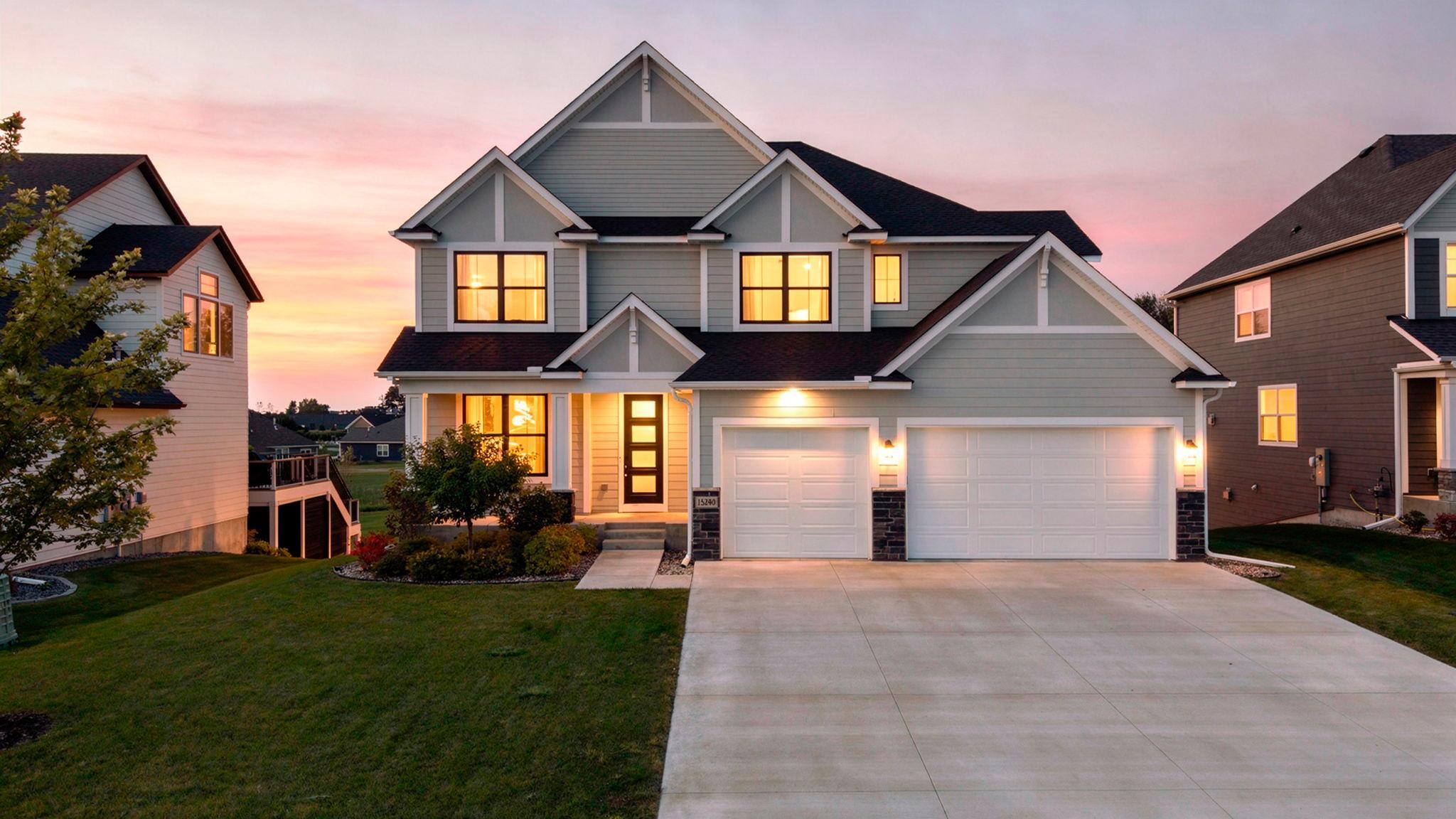 Welcome to this stunning custom-built 2021 Hanson home in Maple Grove, offering 4 bedrooms, 5 bathrooms, exceptional craftsmanship, and thoughtful design throughout. Ideally located just minutes from Maple Grove High School, Arbor Lakes, dining, shopping, and Elm Creek Park, with hiking and biking trails only ½ mile away and a trail conveniently accessible from the backyard. The HOA also features a shared outdoor pool. The light-filled main level showcases warm hardwood flooring, an inviting foyer with built-in bench, private office with sliding barn doors, and an impressive chef’s kitchen featuring abundant white cabinetry, quartz countertops, oversized island with apron-front sink and breakfast bar, double oven, gas cooktop, pot filler, tile backsplash, and 5x4 pantry. The kitchen opens to both formal and informal dining areas, while the spacious living room offers large backyard-facing windows, gas fireplace, and custom built-ins. A well-appointed mudroom with built-in bench, storage, tile flooring, half bath, and access to the heated, insulated three-car garage completes the main level. Upstairs, the luxurious primary suite features large windows, ensuite bath with oversized soaking tub, tiled walk-in shower, heated floors, and expansive walk-through closet with built-ins connecting directly to the laundry room. Bedrooms two and three offer walk-in closets and access to a Jack-and-Jill bath. Bedroom four features hardwood flooring, walk-in closet, and access to a private walkthrough ¾ bath. A versatile bonus room with double-door entry, 10-foot vaulted ceilings, hardwood flooring, and large windows offers endless possibilities for a home office, recreation room, studio, or additional living space. The finished lower level provides a spacious family room with walkout patio access and rough-in plumbing for a future wet bar, plus a ¾ bath and impressive fitness/recreation area complete with gym equipment and an indoor sports court. Additional highlights include individual HVAC dampers for zoned temperature control, Pella Impervia black windows, 8-foot entry door with privacy glass, upgraded solid-core doors, additional windows throughout for abundant natural light, hot-water circulating pump, and numerous custom upgrades detailed in the seller-provided construction specifications located in the supplements. A truly exceptional home with quality and versatility at every turn!
