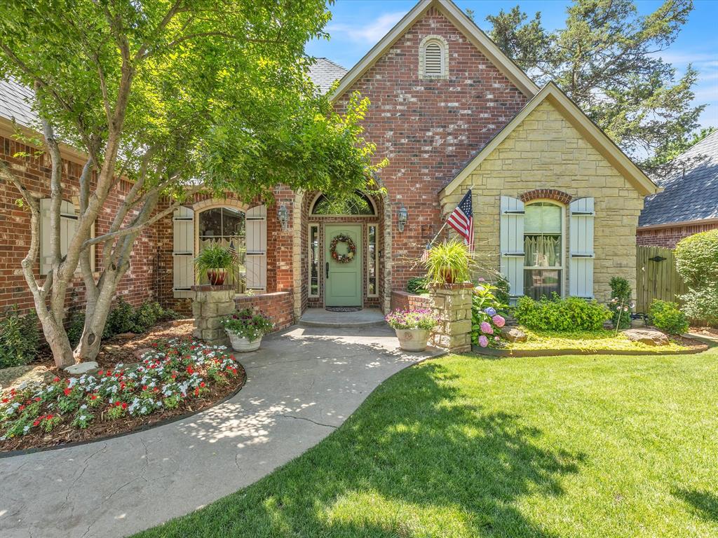 Welcome to 2912 NE 133rd St, a stunning custom home by Dave Schrader located in a private, gated, one-street community. This beautifully designed residence offers 3 bedrooms, 3.5 bathrooms, and 3,380 sq ft of living space with a bonus room upstairs that includes a closet and full bath, making it a flexible option for a 4th bedroom or guest suite. Inside, you’ll find hickory wood floors, cathedral ceilings with distressed beams, a rock fireplace, granite countertops, pecan custom cabinetry, and brick pavers in the laundry room. The kitchen is a chef’s dream with a large center island featuring a new built-in gas cooktop, new double ovens, a new refrigerator, and a Bosch dishwasher. The home also includes a sprinkler system, security system, and gorgeous mature landscaping in both the front and back yards. Outdoor living is exceptional with a large covered patio complete with a built-in grill, wood-burning fireplace, ceiling fan, and stamped and stained concrete, offering the perfect setting for entertaining or relaxing year-round.