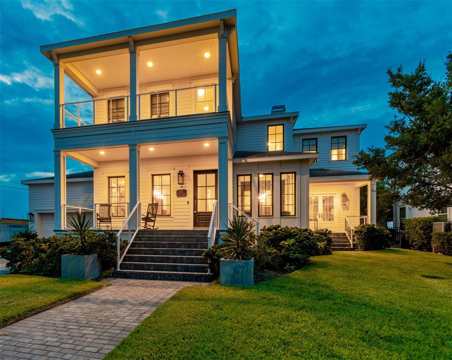 Welcome to 5811 Mariner Street.  Set in the sought after waterfront enclave of Mariner Estates in Beach Park on the open waters of Tampa Bay, this spectacular 5006 sf builder's own custom home exemplifies the best of contemporary coastal design, timeless style and stunning location.  The home features 5 bedrooms, 4.5 baths, plus an office.  The first floor offers a beautiful and private in law or guest wing, formal living and dining rooms, with views of the bay, open floor plan with chefs kitchen overlooking the great room and a 170 bottle wine room.  The second floor primary suite is unequaled in its spa like atmosphere.  Outdoors enjoy the spectacular resort style pool and private dock and boat  lift.  Enjoy the luxury of true waterfront living in Mariner Estates, located minutes to famed Tampa International Airport, top rated public and private schools, world class luxury shopping and dining at International Plaza and Hyde Park Village, Westshore, Midtown and Downtown Business Districts, and the Nation'sTop Beaches.  You can have it all!