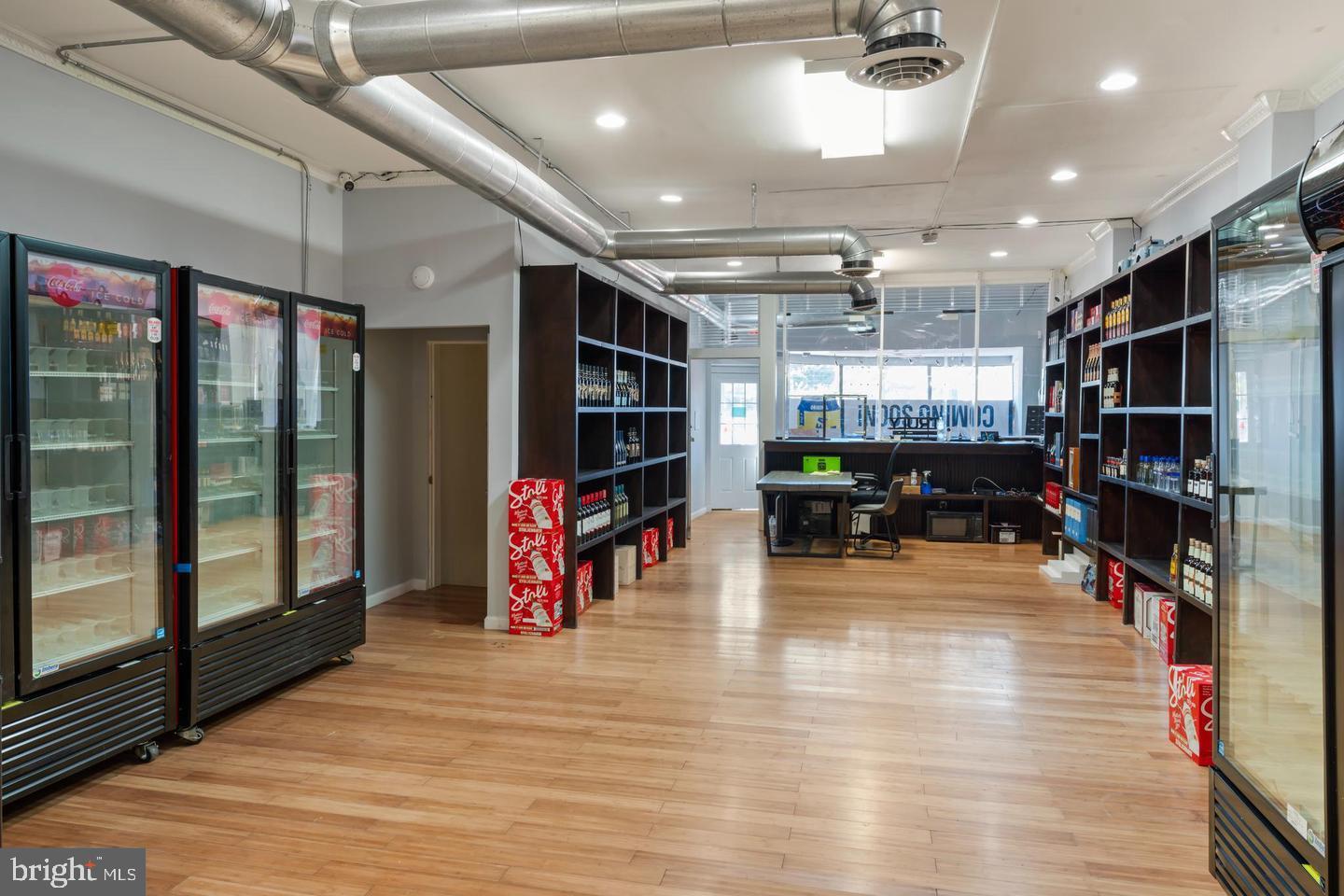 This exceptional three-level mixed-use property offers prime visibility, flexible space, and strong income potential in one of DC’s most active corridors.This property is zoned for commercial use and was previously operated as G-Spot Lounge, which held a Class A liquor license. It currently holds an active Class A EBRA license (online-only for liquor). The property includes two levels of retail/multi-purpose commercial space and a contemporary 2-bedroom, 2-bath condominium on the top floor. The main level offers approximately 1,500 square feet of high-visibility retail frontage, ideal for grocery stores, coffee shops, bakeries, day spas, hair or nail salons, massage centers, sandwich shops, and more. The lower level provides an additional 1,500 square feet of space suitable for storage, back-office use, or expansion, with convenient rear access from the alley.The top-floor condo offers a bright and contemporary 2-bedroom, 2-bath layout, featuring an open-concept living and dining area, a deluxe kitchen with island, gas stove, stainless steel appliances, custom bathrooms, a walk-in closet, washer/dryer combo, and central A/C — all with no condo fee. Situated within walking distance of Rock Creek Park, Petworth, and Columbia Heights, this property combines visibility, versatility, and lifestyle convenience in one outstanding investment opportunity.Positioned along the bustling Georgia Avenue corridor with exposure to approximately 26,000 vehicles per day, this property benefits from strong traffic visibility and accessibility. It is just minutes from the Georgia Ave–Petworth Metro Station and only a 9-minute bus ride (Route 70), ensuring convenience for both pedestrians and commuters. The surrounding area boasts a population of 163,048 residents within a 10-minute drive and a median household income of $108,211, offering an excellent consumer base. Originally built for use as a liquor store, the property also provides the potential to purchase the existing liquor business, making it ideal for investors or owner-users seeking immediate opportunity.