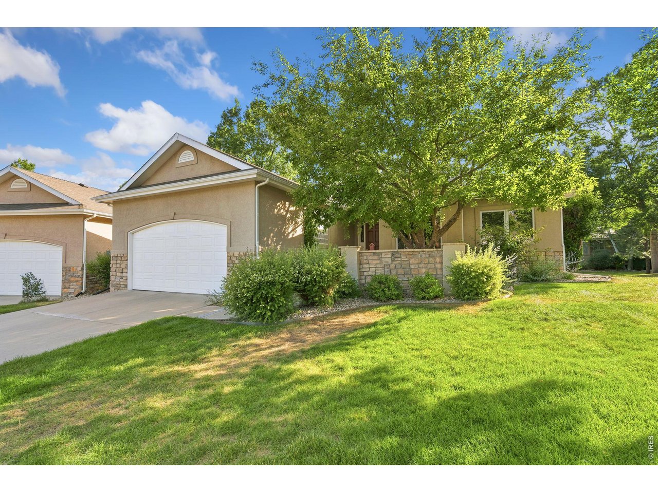 Maintenance-free living awaits in this beautifully maintained patio home in one of Fort Collins' most desirable neighborhoods! The vaulted living room features a gas fireplace and built-in shelving, flowing into a dining room with a built-in buffet and wood flooring. The kitchen impresses with crown-molded cabinetry, a granite island, black appliances, built-in microwave/oven, and pull-out drawers for extra storage. The primary suite offers a large walk-in closet and a 5-piece bath with a soaker tub and tiled floor. A front office with French doors and a second bedroom complete the main floor with 9' ceilings. Downstairs, the massive finished basement includes a second guest bedroom (non-conforming), full bath, and an exceptionally clean, oversized storage room. Enjoy a covered back deck, oversized 2-car garage with built-in bench/shelving, and a huge laundry room with sink, counter, and bench. Recent updates include a new roof (2017), HVAC (~5 years), and new main-floor carpet. HOA covers snow removal, landscaping, and common areas - truly lock-and-leave living!