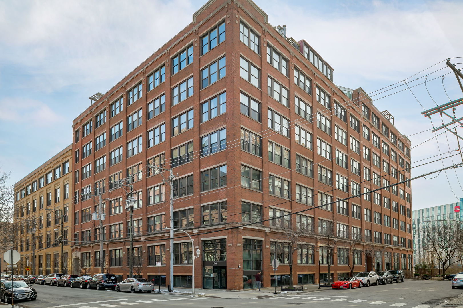 Are you tired of cookie cutter, looking for a unique space with fantastic city views, a private movie theater and the ultimate luxury loft vibes... here it is!  Welcome home to this expansive 4 bed 4 bath Penthouse loft in the hottest West Loop location. Truly a unique home, with oversized windows this corner unit timber loft boasts an abundance of natural sunlight beaming throughout. Spanning just under 4,000sqft this is a home complete with four bedrooms, four bathrooms, an office & a soundproof movie theatre w/ 120" screen, spacious living room & dining area, open layout showcasing a gourmet kitchen including custom cabinetry, quartzite countertops, & professional-grade appliances such as a Subzero 146-bottle wine fridge. Massive primary suite with an equally large spa like primary bathroom complete with a soaking tub, custom glass walk in shower with fold out seating, heated floors & heated towel rack, a fireplace, motorized blinds, & a handmade Bespoke walk-in closet. The open concept living area has a spiral staircase leading up to the office & expansive private 1500sqft rooftop deck w/ a grilling station, outdoor daybeds, & large hot tub w/ views of the city skyline. Located in the West Loop neighborhood near the hottest restaurants on Randolph Street & Fulton Market, Google , Greek Town, Parks, shops and the highly sought after Skinner school district ("10" city school). Walking distance to Whole Foods, Target & CTA Blue Line. There is no parking at the building, parking is leased. There are several parking lots with rental spots available or a secure garage with leased parking about a block away.