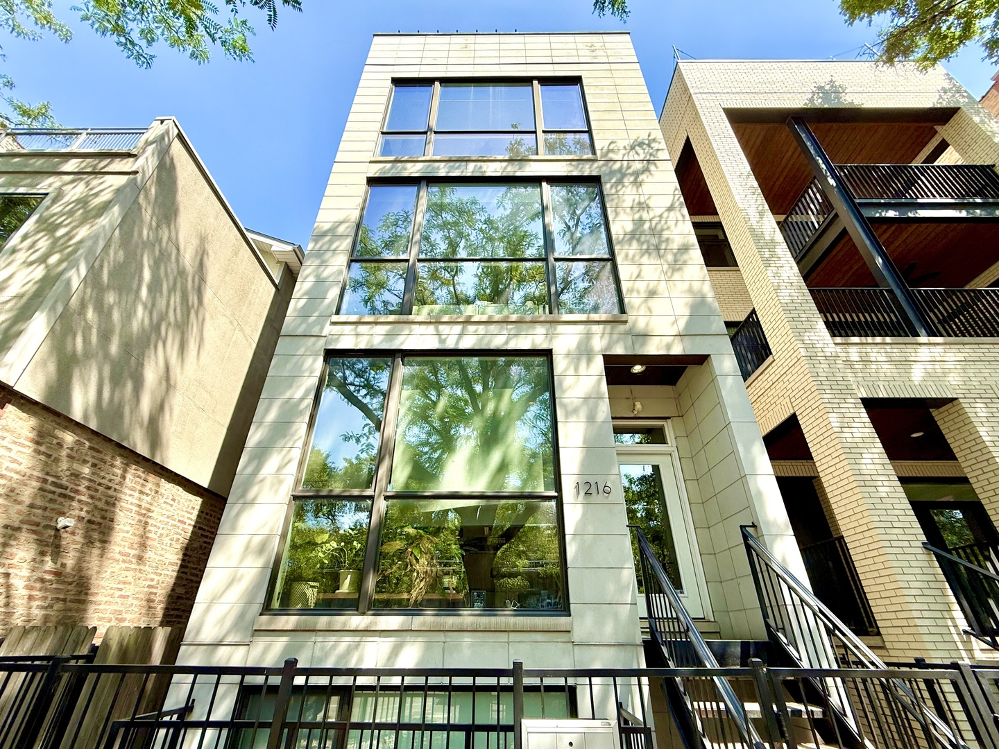 Sophisticated and Modern 2-bedroom, 2-bathroom residence with a PRIVATE rooftop deck, perfectly nestled on a picturesque, tree-lined street in the highly sought-after Fulton Market/West Town neighborhood.  Soaring ceilings and expansive windows flood the space with natural light, accentuating the home's bright, airy ambiance. The sleek, modern kitchen is a chef's dream, featuring quartz countertops, premium Bosch and Thermador appliances, and a striking counter-to-ceiling backsplash. The spacious primary suite boasts a walk-in closet with custom built-ins, while the luxurious, spa-inspired bath includes heated floors, dual vanities, a separate soaking tub, and a steam shower for the ultimate in relaxation. 2nd bedroom is a generous size w/ additional shelving, built-out closet, and built-in Murphy bed. Beautiful oak flooring runs throughout, complemented by a built-in audio system for seamless entertaining. An interior staircase leads to an upper-level wet bar with a refrigerator, opening to your expansive private rooftop oasis - spanning the entire footprint of the unit - and offering panoramic skyline views, perfect for unforgettable gatherings. Truly an entertainer's dream with a low monthly HOA. One garage parking space with additional storage racks is included in the price. All this and an incredible location with easy access to Fulton Market, West Loop, Ukraine Village, River West, Grand Blueline station, Hwy 90/94 as well as countless restaurants and shops!