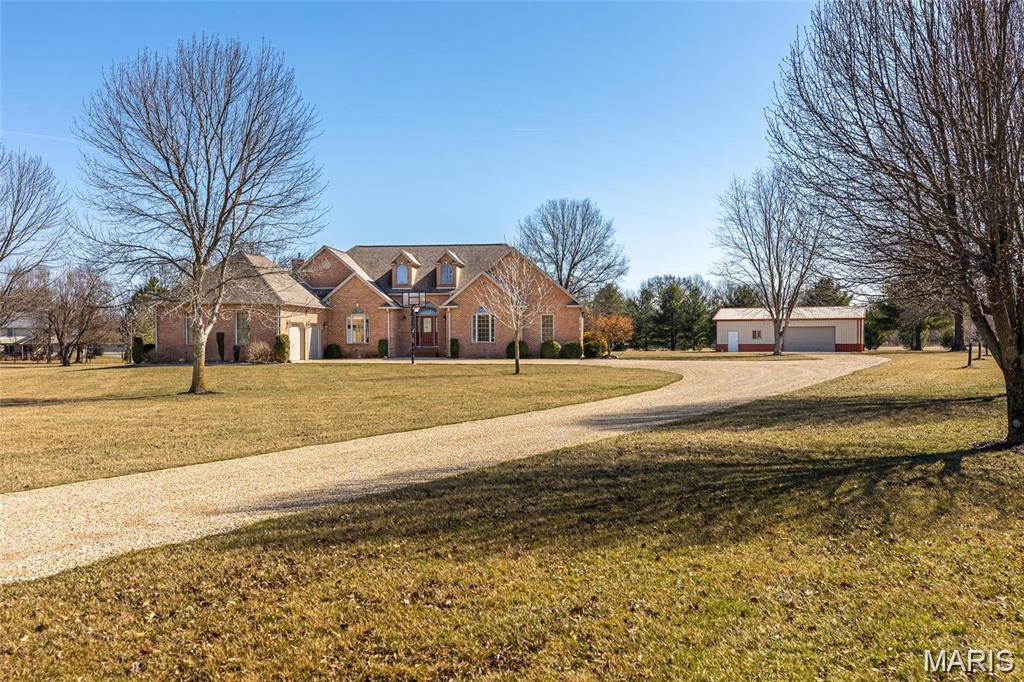 SIMPLY STUNNING! 5 bedroom 4.5 bath home located in peaceful Deer Hollow Lane subdivision. Nestled on 4.97 acres, you’ll appreciate all of the amenities this home has to offer. Vaulted ceilings in many rooms, spacious, open kitchen with adjacent family room. Formal living room and formal dining room for additional entertaining space. Main Floor primary bedroom & en suite. Three additional bedrooms, full bath, laundry space, and a half-bath. Upper level has fifth bedroom with attached bath and a bonus room that is also being utilized as a sixth bedroom. Mostly finished lower level is an ideal recreation room. There’s an additional bonus room in lower level with a full bath. Outside you’ll find a 1,380 sq. ft. outbuilding. If you enjoy nature, there’s plenty of it to be found! Abundant wildlife can be watched from the comfort of your back deck - especially LOTS of deer! If you’ve been looking for a one-of-a-kind home, this is it!