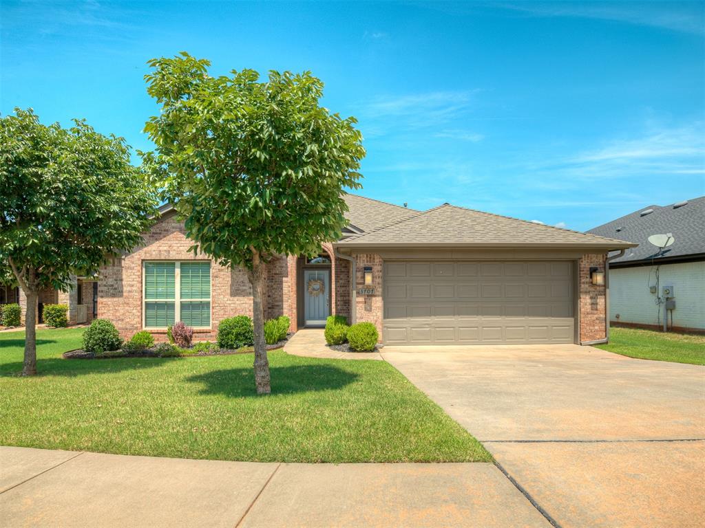 This charming 3-bedroom, 2-bathroom home is nestled in a friendly, well-maintained neighborhood. As you step inside, you'll be greeted by a spacious, open-concept living area with plenty of natural light. The cozy living room features a beautiful fireplace, perfect for cozy evenings. The kitchen is a modern delight, complete with sleek stainless steel appliances, ample counter space, and plenty of storage. The primary bedroom offers a peaceful retreat, complete with an en-suite bathroom, while the two additional bedrooms provide versatile space for family, guests, or a home office. Washer and dryer included. Step outside onto the private back patio, an excellent spot for outdoor dining, grilling, or simply unwinding in the fresh air. In the garage there is a storm shelter for added safety. The home is situated in a peaceful, desirable neighborhood, which features a walking trail, splash pad, playgrounds, ponds, and soccer field making it the perfect place to call home.  Every All County Heartland Property Management residents are enrolled in the Resident Benefits Package (RBP) for an additional fee which includes liability insurance, HVAC air filter delivery, on-demand pest control, and much more!