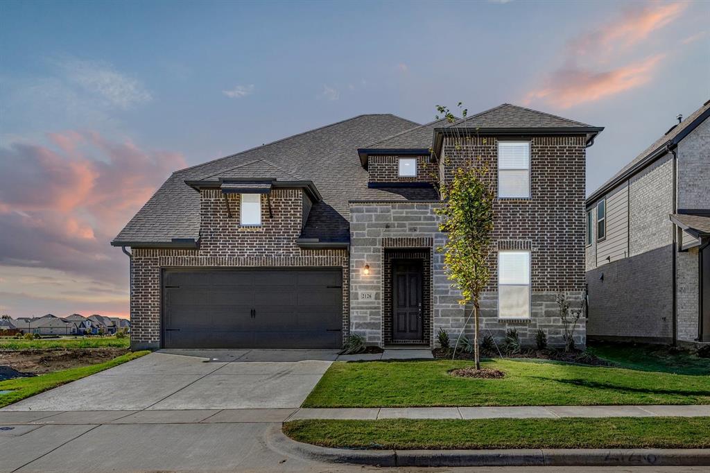 MLS# 21397400 - Built by RockWell Homes - October 2026 completion ~ Welcome home to a beautifully designed 5 - bedroom, 4 - bathroom residence offering exceptional space, thoughtful finishes, and room for everyone. From the moment you enter, the home makes an impression with an oversized 8 - foot solid - core mahogany front door with privacy glass, setting the tone for the quality found throughout. The main level features hard - surface flooring throughout all living areas, creating a clean, cohesive feel while offering easy everyday living. The open - concept living spaces are complemented by designer lighting and plumbing fixtures throughout, adding elevated details without sacrificing comfort. The home was designed for both entertaining and everyday life, featuring a dedicated dining room with a convenient valet pantry, providing additional storage and serving space just off the kitchen. Upstairs, you'll find a large media room and an enormous game room, giving the family plenty of space to spread out, entertain, or create dedicated areas for movie nights, gaming, and recreation. With five generously sized bedrooms and four full bathrooms, there's flexibility for guests, a home office, or growing families. The home's thoughtful layout provides both shared gathering spaces and private retreats. Step outside to the large covered patio, offering an ideal extension of the living space for outdoor dining, entertaining, or simply enjoying the evening. Additional standout features include 8 - foot, 5 - panel interior doors, upgraded designer fixtures, quality hard - surface flooring throughout the first - floor living areas, and a collection of architectural details that give the home a distinctive, elevated feel. Five bedrooms. Four full baths. Media room. Huge game room. Dedicated dining. Valet pantry. Oversized covered patio. Designer finishes throughout. This is a home built to give you the space and features to truly enjoy how you live.