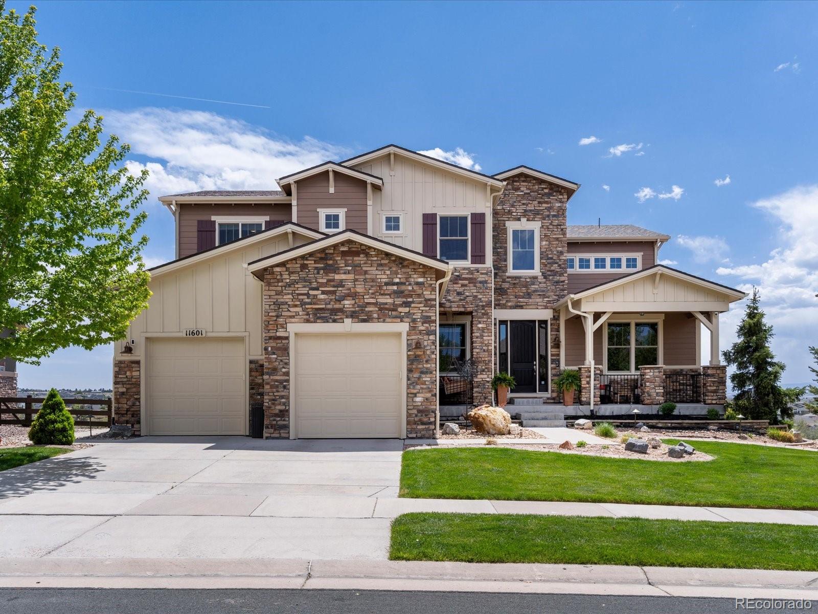 Unobstructed mountain vistas and refined design define this exceptional Highlands residence, where luxury living meets a serene open-space setting in Parker. Backing to protected open space, this home offers a quiet backyard oasis with breathtaking views, enhanced by a large deck and covered patio with a firepit. A dramatic two-story entry with a curved staircase introduces interiors of impressive scale, including a great room with coffered ceilings and a floor-to-ceiling fireplace. The spacious kitchen features a large center island and an oversized pantry, flowing into the dining area with access to the deck. A private office with French doors adds flexibility. The primary suite is a luxurious retreat with a five-piece bath and a custom walk-in closet. The recently finished walkout basement expands the home with a living area and fireplace. With new windows, paid-off solar panels, a finished epoxy-floor garage and a three-car tandem layout, this home offers elevated comfort and efficiency.