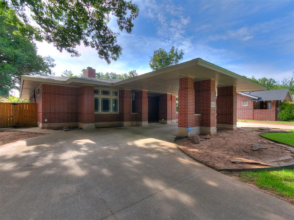 Campus Beauty! A charming 3 Bed, 2 bath, plus flex room and 2 car garage with alley access, less than 1/2 mile from campus! Beautiful wood floors, high ceilings, open plan with plenty of windows bringing in the natural light. Enjoy the primary bedroom with 2 walk-in closets, double vanity and laundry room nearby for convenience. Large covered patio for hosting and enjoying the fall game days. Plenty of parking with a circle drive. Walking distance to Campus Corner, Midway Deli and Lindsey St, and in McKinley Elementary School district.