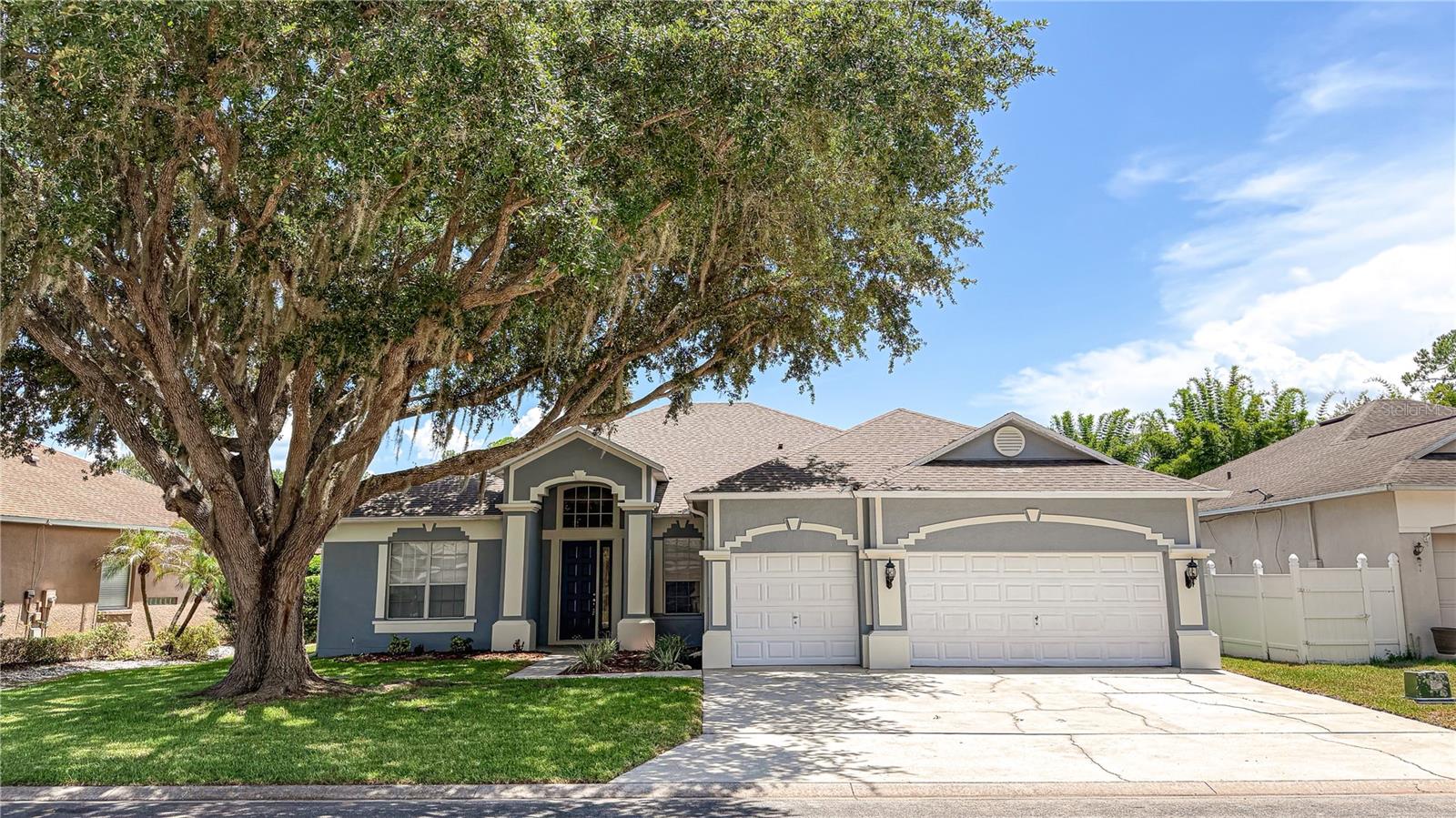 Beautiful home on a stunning gated golf course community! Prepare to be wowed by this spacious and recently remodeled home. This property boasts an open, split floor plan, separate family and living rooms, formal dining and dinette, large chefs kitchen overlooking family room with fireplace,  4 large bedrooms, Office/flex/5th bedroom, with private access from the huge Primary bedroom, vaulted ceilings, large windows, huge covered lanai, private pool area, spacious laundry room and three car garage. The extensive remodel includes a brand new roof 2026, paint inside and out, recent pool resurface, updated appliances, pool pump, vinyl privacy fencing, and luxury vinyl plank flooring.
