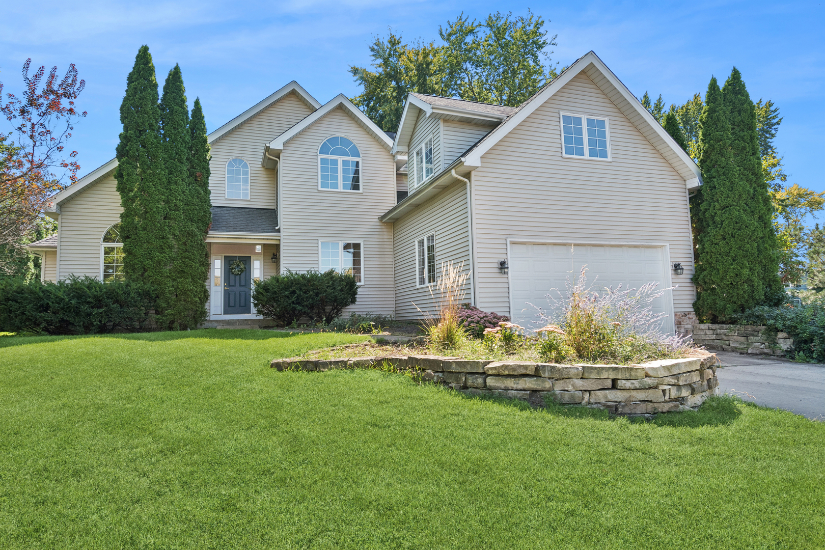 First Time on the Market from Original Owners! Welcome to this truly one-of-a-kind custom home, designed with multi-generational living in mind and offering over 3,200 finished square feet-plus an additional 2,000+ square feet of potential in the unfinished basement! Situated on a private, fully fenced half-acre lot, this home offers a unique and versatile floor plan ideal for families of all sizes. The main floor primary suite features a spacious walk-in closet, dual vanity, and separate soaking tub and shower. Also on the main level is a second bedroom and full bath-perfect for guests or easily converted into a private en suite. The main level showcases soaring two-story ceilings and gleaming hardwood floors throughout (except in the primary bedroom), creating a bright and airy atmosphere thanks to abundant natural light. The open-concept, eat-in kitchen features granite countertops and flows seamlessly into the backyard-ideal for indoor/outdoor entertaining. You'll also find a formal living room, separate dining room, and first-floor laundry for ultimate convenience. Upstairs, you'll find three additional bedrooms, including a massive bonus room that can be used as a playroom, guest suite, or home office. A large loft space overlooks the family room below, enhancing the home's open feel and natural light. The second floor also includes a full bathroom with dual vanity and separate water closet, ideal for busy mornings. The unfinished basement provides endless potential for customization-create your dream home theater, gym, or recreation room. Enjoy outdoor living in the expansive backyard, perfect for gardening, playing, or entertaining. The large deck with gazebo is the perfect spot to relax or host guests. Located in the award-winning Wheaton/Warrenville School District 200, this home offers easy access to highways, nature preserves, shopping, and fine dining. Don't miss your chance to view this wonderful family home - schedule your private tour today!