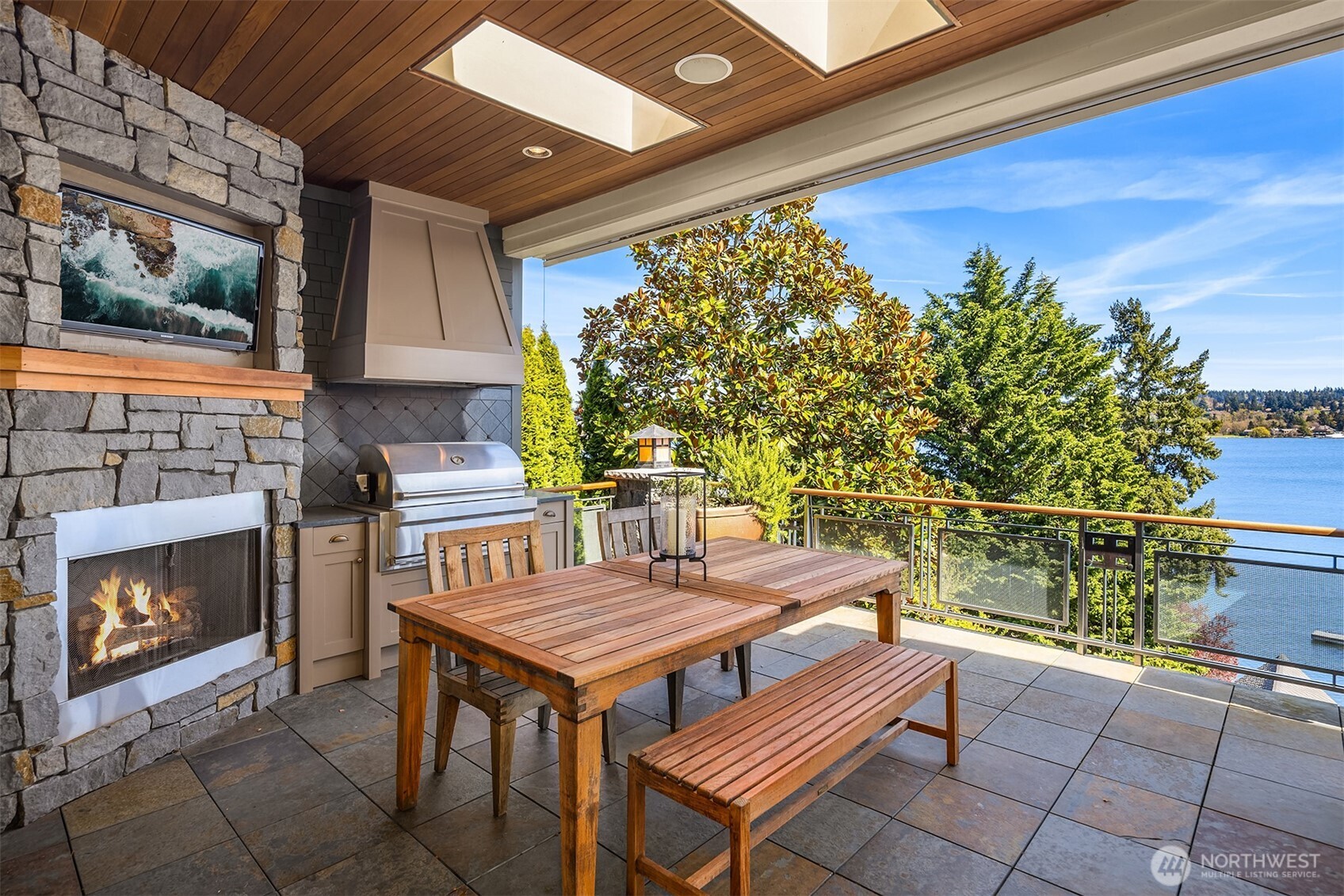 Fire up the grill, catch the game and unwind by the fire - all in a covered outdoor living area designed for all season enjoyment.