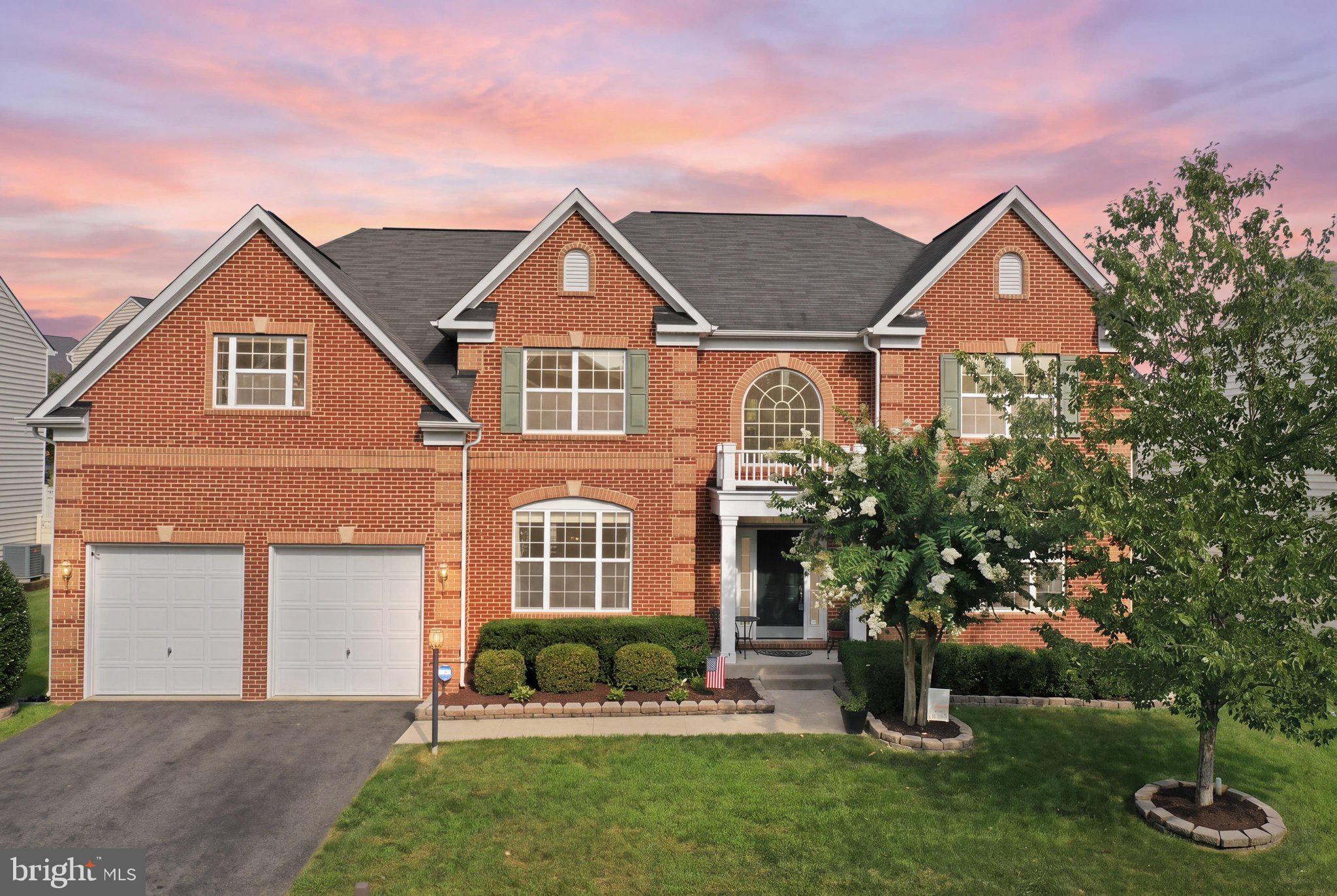 Nestled in sought the after Greenfield Crossing neighborhood, this impressive Manhattan model by K Hovnanian Homes offers nearly 6,000 finished square feet with exceptional space for everyday living and entertaining.Step inside to a dramatic two story foyer with a graceful dual staircase and beautiful hardwood flooring. Formal living and dining rooms provide an elegant setting for special occasions. The heart of the home is the expansive gourmet kitchen with granite countertops, stainless steel appliances, abundant cabinetry, and a generous center island that invites everyone to gather. The kitchen opens to a light filled family room where a soaring two story stone fireplace creates a stunning focal point. A private main level office provides an ideal space for working from home.The upper level features a spacious primary suite along with three additional bedrooms and well appointed bathrooms. Each room offers the space and flexibility needed for family and guests.The finished lower level is far more than an afterthought. A fifth bedroom and full bathroom provide comfortable guest accommodations. The recreation area offers room to relax and entertain. An additional flex room is ready to become a theatre room, playroom, home gym, or hobby room. Ample storage completes this versatile level.Outdoor living is just as inviting. The fenced rear yard offers privacy and an expansive stone patio with a fireplace that is perfect for quiet evenings and memorable gatherings. Established landscaping and a two car garage add everyday convenience.Greenfield Crossing offers walking paths, playgrounds, and common areas. A convenient Aldie location is close to shopping, dining, recreation, and major commuter routes. Routes 50, 15, and 606 are within easy reach along with the Dulles Greenway, Dulles International Airport, Stone Ridge, Brambleton, and the many amenities of eastern Loudoun County.Seller will consider a $15,000 credit with an acceptable offer, giving buyers the opportunity to personalize the home’s carpeted spaces.