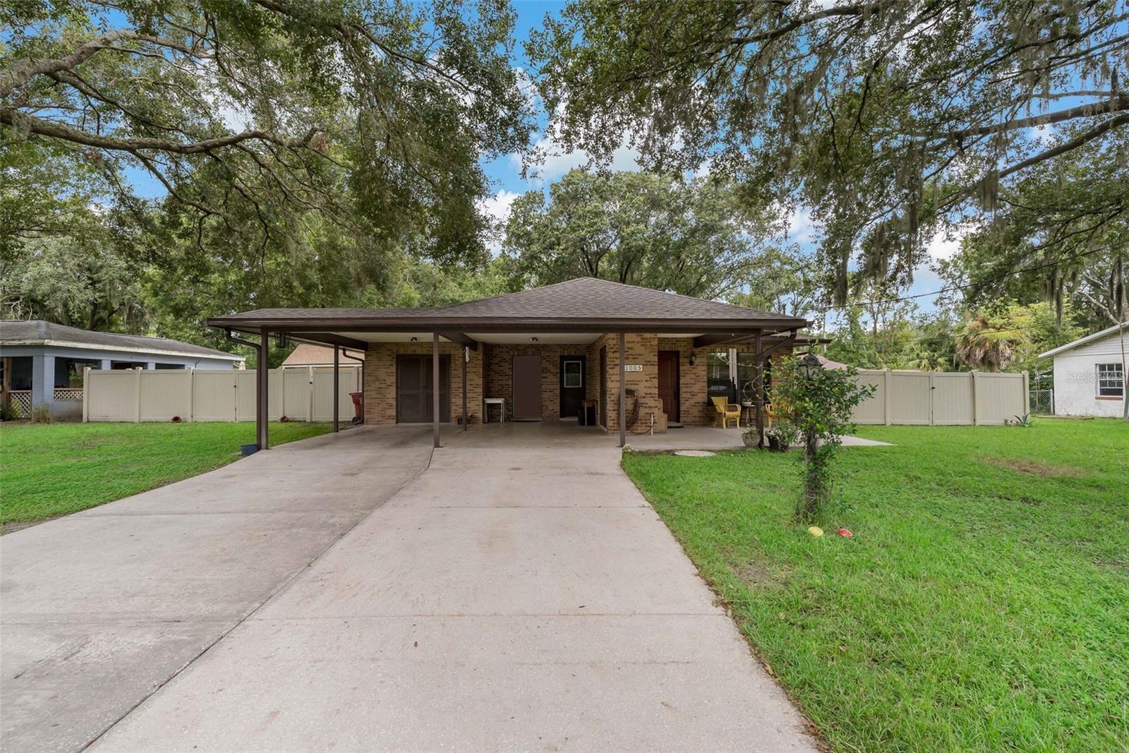 Stunning Fully Updated Block Home - Move-In Ready!. This meticulously renovated block home is a must-see, boasting modern upgrades and thoughtful improvements throughout. Featuring a brand-new roof (July 2025 w/4-Pt wind mitigation certification) and new upgraded electrical panels (indoor and outdoor installed June 2025), this home combines durability with contempporary style. The 2-car carport includes convenient storage, annd the oak tree-shaded lot offers a serene, picturesque setting, fully enclosed with a combination of vinyl and chain-link fencing with double door gates on each side of the yard for easy access, functionality, privacy & security. Enjoy outdoor living on the over-sized screened porch with electrical access, ideal for private relaxation or entertaining. Thhe property also features a 12x15 ft storage shed w/lofts and work table w/power, perfect for hobbies or extra storage. A mud room keeps the home clean, while a hybrid water filtration system with softener ensures quality water throughout. Additional highlights include a Pravia entry door with a ENERGY STAR certification, upgraded gutters in 2023. and a new hot water heater with 5 years left on the warranty for peace of mind. Step inside to discover an open-concept living and dining area with new luxury vinyl flooring throughout the main living spaces and tile in wet areas. The entire interior has been freshly painted, creating a bright and welcoming atmosphere. The completely remodeled kitchen (June 2025) featuring shaker-style cabinets, granite countertops, garbage disposal and a modern appliance package including a new microwave and dishwasher. The master suite is a true retreat, complete w/large walk-in closet & MBA. Elegant granite is also features on the bathroom vanities and windoswsills throughout the home, adding a touch of luxury. The dining room showcases a stunning accent wall, perfect for gatherings and entertaining. This home is packed with value and ready for its new owners. Don't miss your chance to own this beautifully updated gem. Schedule a showing today before it's gone!