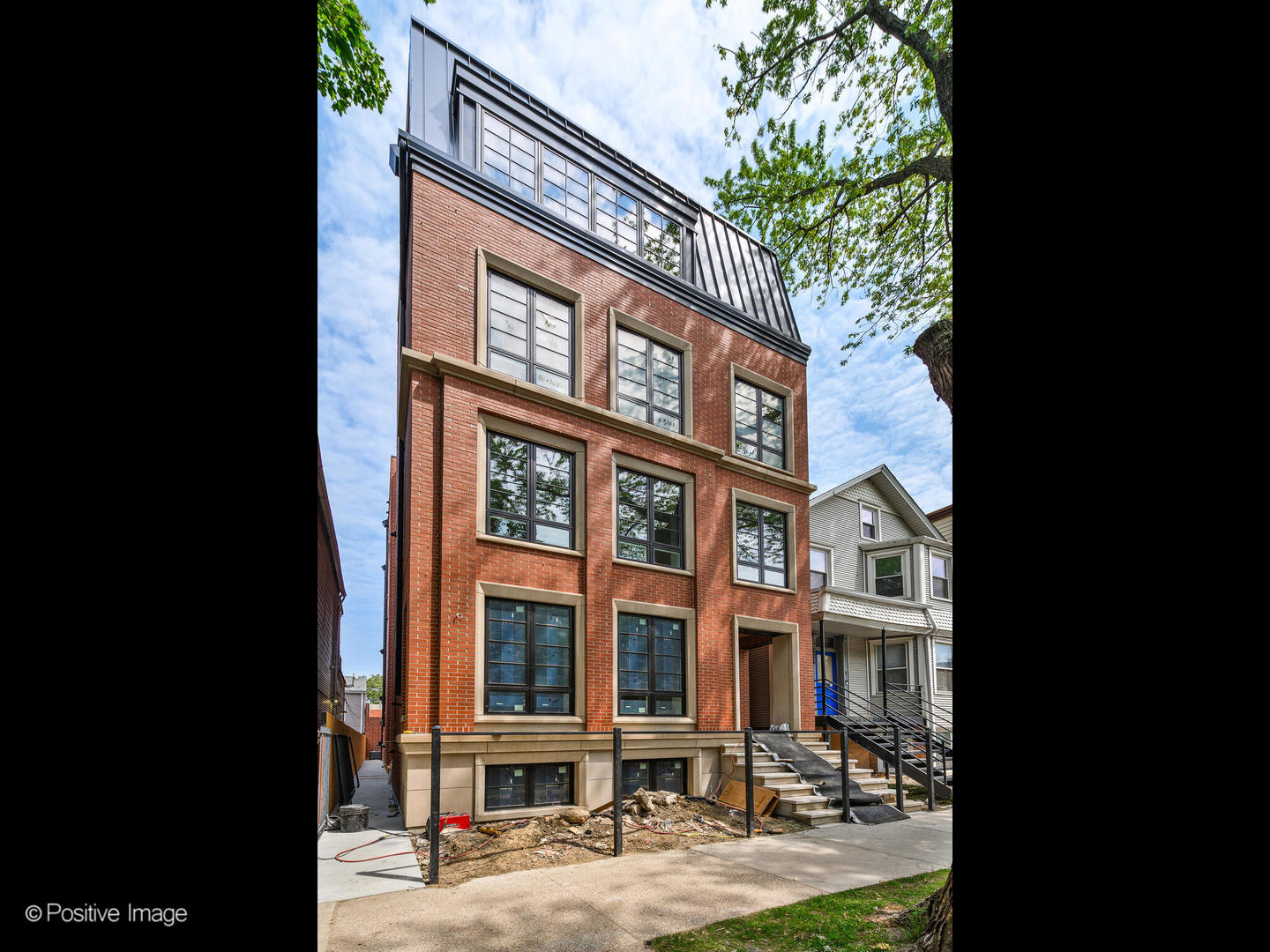 Experience unmatched space in this MOVE-IN READY, NEW CONSTRUCTION FULL MASONRY Simplex Condo, uniquely designed with business zoning density, allowing for a SIGNIFICANTLY LARGER footprint than a standard simplex-plus an outdoor terrace off the living space for ultimate urban living.. This new luxury building features a sophisticated design, including a Mansard metal roof, limestone details, and 8' tall windows. High-end interiors boast Thermador appliances, custom cabinetry, quartz countertops, heated primary bathroom floors with steam shower, and curbless showers. Private outdoor space include porcelain pavers off the family room, while additional soundproofing with lightweight concrete floor measures ensure comfort. Additional features include high-efficiency mechanicals, smart home wiring, and a garage pre-wired for EV charging. Premium finishes throughout complete this modern, high-end residence. *Photos are of actual unit. Renderings and plans, etc. are for marketing purposes only; finishes/plans may change at the discretion of Seller. Buyer(s) and their representation to confirm all finishes prior to purchase.   Buyer's Broker must attend all showings/appointments.