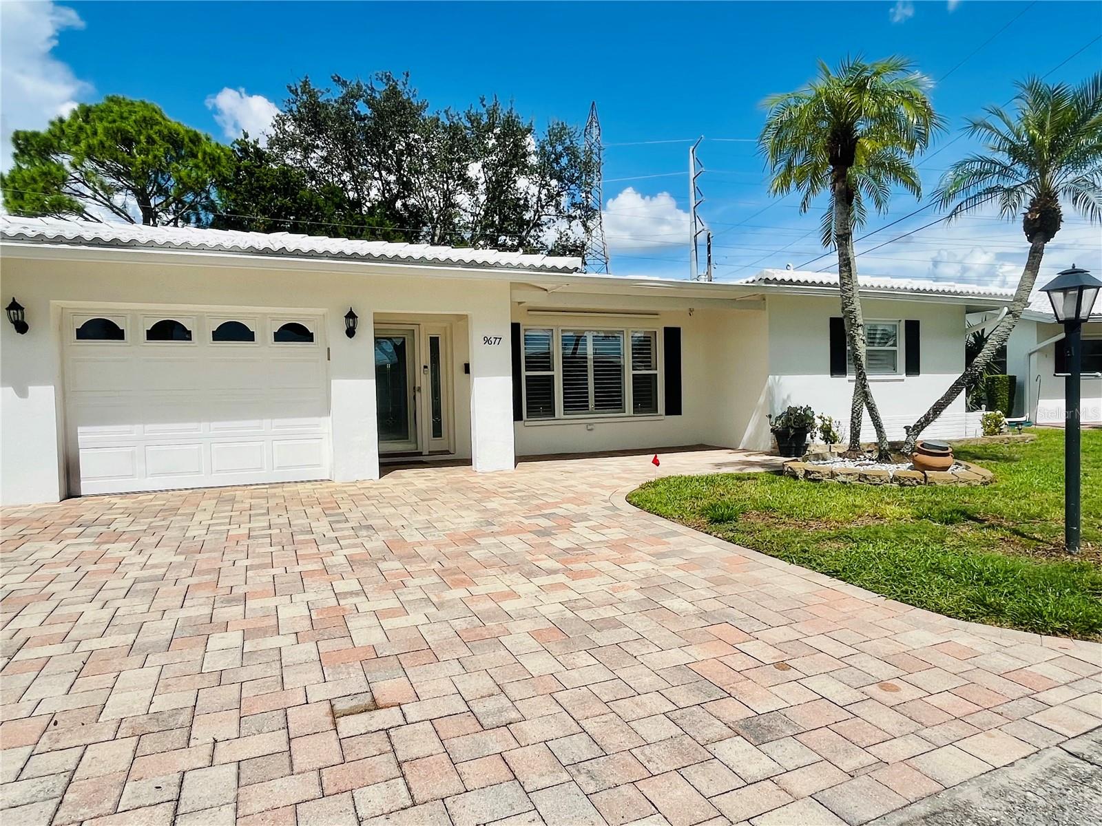 This is the Florida Dream Home (Non-Evacuation Zone) you have been waiting for located on the golf course and at a budget friendly price.  Located in The Mainlands an active senior community; this remodeled 2 bedroom/ 2 bathroom masonry block ranch boast over 1,600 htd sq feet. An entertainers delight with a chefs kitchen featuring high end cabinetry, solid surface counter tops, pantry and stainless steel appliances (dishwasher included). The home features newer double pane windows, plantation shutters, easy care flooring, abundance of closet space, light and bright colors give a tropical feel.  Relax in your garden tub or your easy step in shower with glass surround. Pinellas Park is centrally located between St Petersburg and Clearwater. There is so much to see and experience from World Class Beaches, Museums, Fine Dining, and more. Easy access to I 275, St Pete & Tampa International Airport makes traveling convenient for everyone. Don't let this one get away.