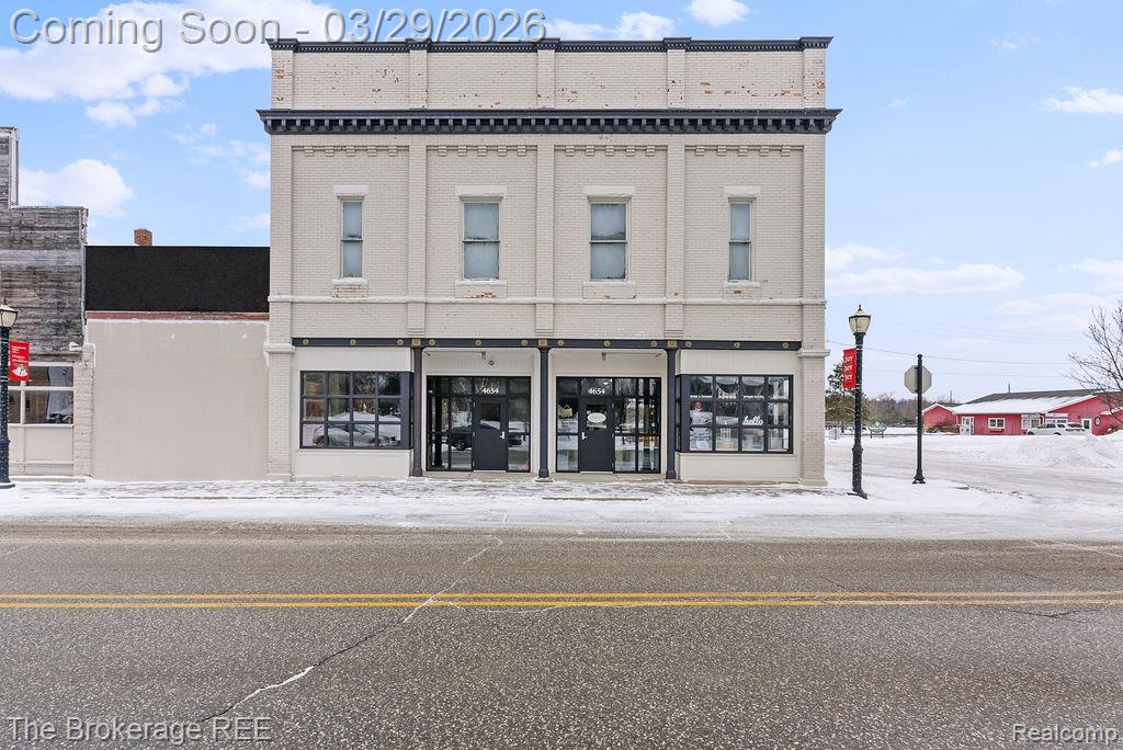 Positioned in the heart of downtown Columbiaville, this beautifully restored historic building seamlessly blends original character with modern efficiency. Showcasing exposed 18” brick walls, beadboard ceilings, and original heart pine flooring, the property has been fully upgraded with new plumbing, mechanical systems, and six 200-amp electrical panels.Offering 6,000 SF across five main-level suites, plus an additional 3,000 SF on the second floor and 3,000 SF in the unfinished basement, this versatile, multi-use property presents exceptional opportunity for business growth or investment. Commercial-grade doors and windows and ample downtown parking enhance accessibility and convenience. The vacant parcel directly behind the building, along with the adjacent lot (now hardware store facade), are also available for purchase, presenting an excellent opportunity to incorporate a drive-through, if desired.Ideally located between M-15 and M-24, just 10 miles north of I-69, the property benefits from strong visibility and steady foot traffic. Nearby, Holloway Reservoir Regional Park spans 5,500 acres with boating, fishing, hiking, and horseback riding, while the Southern Links Trailway—just one block away—offers a 10.2-mile scenic route connecting surrounding communities. A biweekly farmers market, annual events, and local campgrounds drive consistent visitor activity, further supporting commercial potential. 10 min from newly added Target, Hobby Lobby and 3 miles from Marriott's Post Card Cabins. Whether expanding your business or generating rental income, this property offers unmatched flexibility in a growing community. A rare opportunity to own a true historic asset.Please note: Units 2–5 and portions of the second floor have been virtually staged in select photos to illustrate potential uses. There is currently no finished bedroom or full bathroom on the second level; this has been noted per Realcomp requirements.