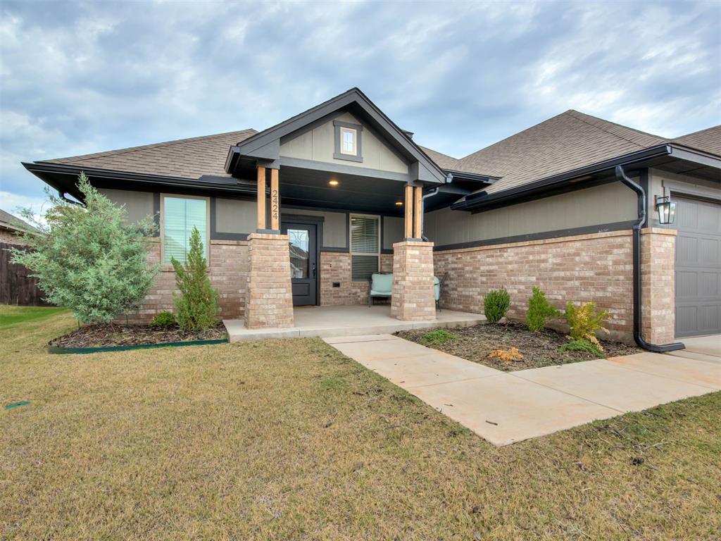 Built in 2024 with a transferable 10-year foundation warranty, this Edgewater home gives you new-build peace of mind without the wait. The layout is the real win. A true mother-in-law split gives a parent, adult kid, or long-term guest their own side of the house, with privacy for everyone.The kitchen sets the tone with sage green shaker cabinets, a natural wood island and range hood, a gas range, and a marble-look tile backsplash. The island seats four, and the dining area sits right beside it. The living room has a tiled electric fireplace with a wood beam mantel and a wall of windows that pulls in natural light. Wood-look tile flooring runs through the main living spaces.The primary suite has a double vanity, a soaking tub, a walk-in shower, and a big walk-in closet. A separate study gives you a real workspace. The mud room has a built-in bench and laundry space, right off the 3-car garage.Out back, a covered patio looks over a big backyard with plenty of room to play or garden. Edgewater has its own neighborhood playground, and the home is in Moore Public Schools. You're off SE 19th between Bryant and Sunnylane, close to I-35, Tinker AFB, shopping, and dining. Schedule your showing today.