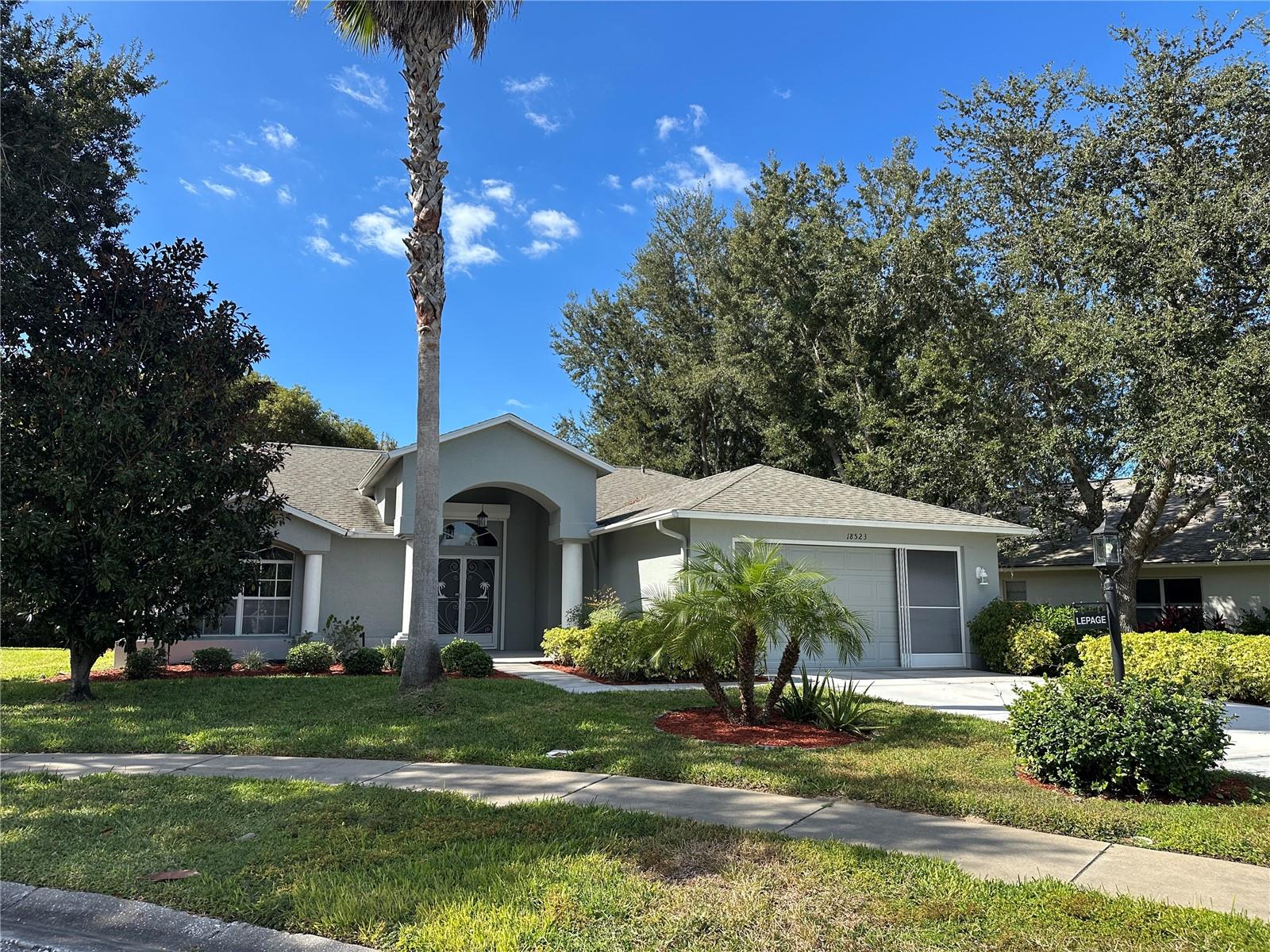 Move-In Ready & Exceptionally Maintained – Heritage Pines 55+ Golf Community Don’t miss this beautifully cared-for home offering bright, open living in one of Florida’s most desirable active adult communities. Step inside to a light-filled interior with soft neutral tones and a flowing, open floor plan. The split-bedroom layout provides comfort and privacy, while the spacious great room connects seamlessly to the kitchen—perfect for entertaining. Enjoy cooking in your inviting kitchen with newer appliances, and unwind in this home’s lanai overlooking a peaceful conservation area—no rear neighbors for ultimate privacy! This home also offers a fantastic spa-like atmosphere ideal for relaxation and rejuvenation—your own private retreat in a tranquil, serene setting. Additional highlights include a water softener system and a new sliding glass door for added peace of mind. Heritage Pines offers resort-style living with a championship golf course, clubhouse, heated pool, beautiful restaurant, woodworking shop, tennis, pickleball, gaming room, craft room, performing arts center, and numerous clubs and activities. Just minutes to beaches, shopping, dining, medical facilities, and an easy drive to Tampa or Clearwater via the Suncoast Parkway. This is a must-see home—you will not be disappointed!