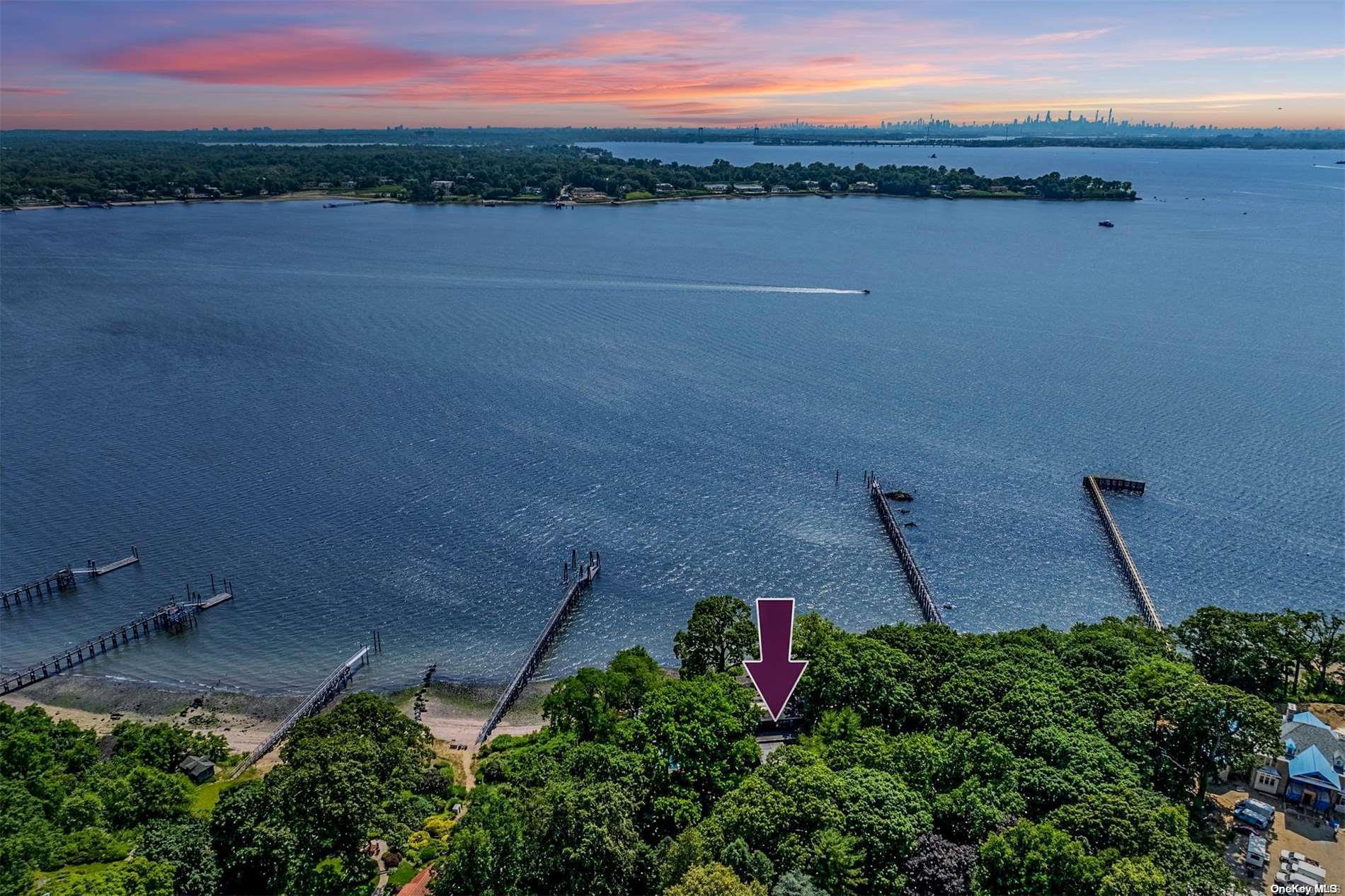 Welcome to a legacy property for you to secure for generations to come. The 5.7 Acres are a secluded Oasis.  With paths and winding drives, sitting areas and gardens.  There is a cottage at the foot of the property standing sentry along the brick columns that secure the two entry drives with majestic iron gates. Please refer to the survey attached to get a representation of how well this property lays out.   The House itself is on Manhasset bay and not visible from the street.  There is a three car garage also on the property that once housed the driver of the estate. The home is architecturally bold.  It grabs the the light air and space of the property and brings it inside.  The walls of glass facing the water give you the feeling you are on a yacht. The modern open stair case creates a dramatic view over the atrium into the grand living space.  Privacy, elegance, serenity, are words that come to mind when watching the sun set every evening.  You are in the front row of earths greatest show.  NYC and sailboats add to the priceless views. The deep-water dock allows you to keep your Yacht at home.  And if you want to commute by boat to NYC the ride is only 30-45 minutes.  The gated tennis court  and heated pool rounds out the resort experience., Additional information: Appearance:Excellent,ExterioFeatures:Tennis,Interior Features:Guest Quarters