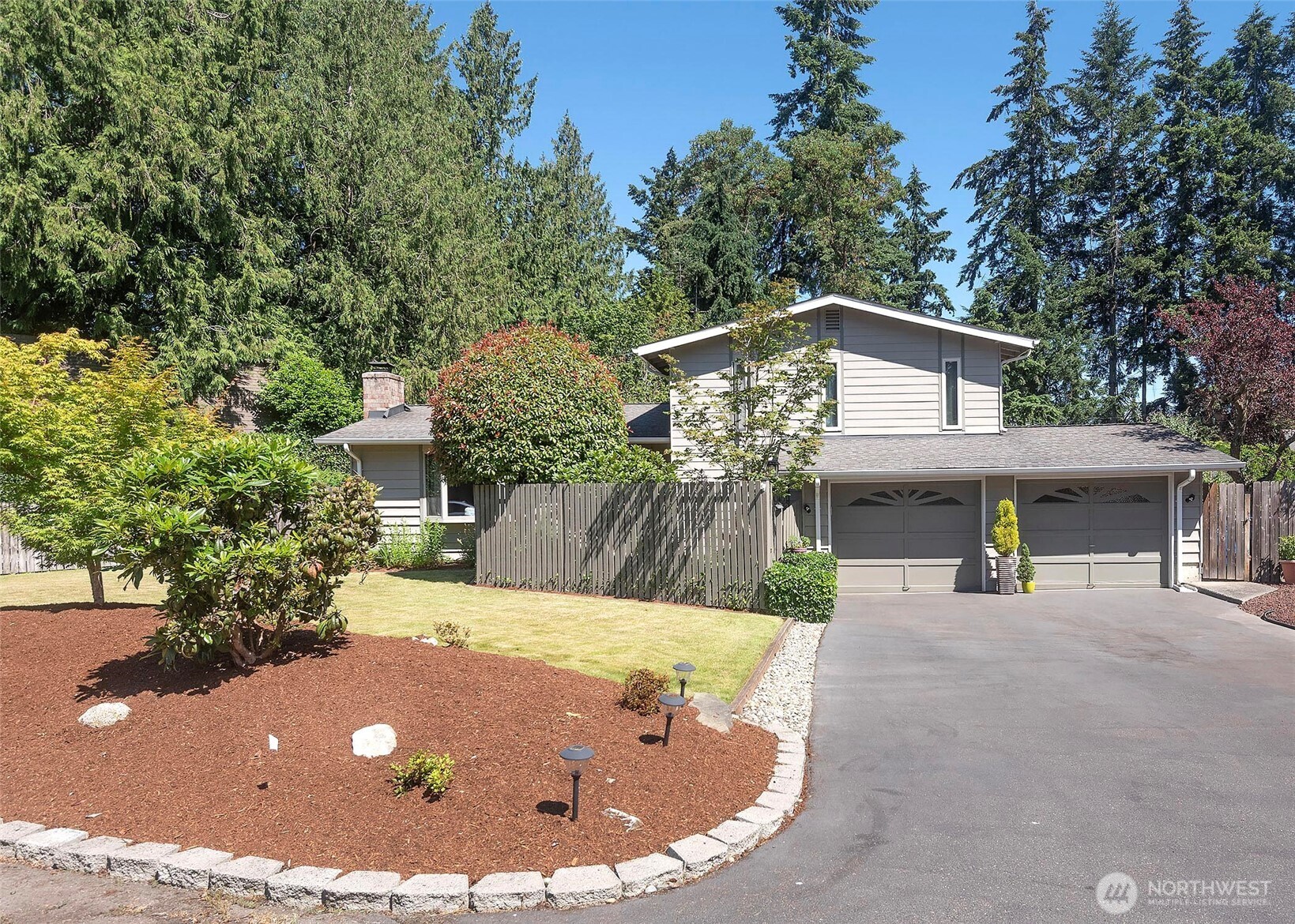 Located just minutes from Yost Park and Pool, downtown Edmonds, and the waterfront, this prime location is hard to beat. Tucked away at the end of a quiet cul-de-sac, this light-filled tri-level home offers a functional and desirable floor plan, along with an amazing yard that provides plenty of space to relax, play, and entertain. Large windows throughout flood the home with natural light and highlight the spacious living areas, complemented by a cozy wood burning fireplace that add warmth and character.  Enjoy morning coffee in the kitchen breakfast nook and lively holidays in the dining room. The thoughtfully designed tri-level floor plan provides separation of space while maintaining an easy flow for everyday living. The upper level features three bedrooms, including a primary suite with an attached 3/4 bath, along with a full bathroom serving the additional bedrooms. The generously sized lower-level recreation room offers flexible living space and is complemented by a convenient half bath. Additional features include a new furnace, a two-car garage, and ample outdoor space to enjoy all that summer has to offer. Set in a sought-after Edmonds location with easy access to parks, restaurants, shopping, and the waterfront, this home is a definite must-see!
