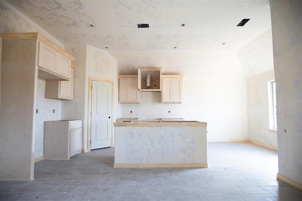 This Bogan floor plan includes 1,510 Sqft of total living space, which includes 1,400 Sqft of indoor living space and 110 Sqft of outdoor living space. There is also a 395 Sqft, two-car garage with a storm shelter installed. This home offers 3 bedrooms, 2 bathrooms, 2 covered patios, an office, and a utility room. The living room welcomes wood-look tile, large windows, a ceiling fan, and Cat6 wiring. The kitchen has 3 CM quartz countertops, stainless-steel appliances, wood-look tile, custom-built cabinets with decorative hardware, and stylish tile backsplash. The primary suite features noteworthy carpet flooring, a ceiling fan, Cat6 wiring, and perfect-sized windows. The upgraded primary bath offers a dual sink vanity with an elegant countertop selection, a tub/shower combo, an elongated water-saving toilet, and a walk-in closet! The outdoor living area is covered and has fully sodded yards with a water saving sprinkler system. Other amenities include a tankless water heater, a fresh air intake ventilation system, R-15 and R-38 insulation, an air filtration system, and so much more!