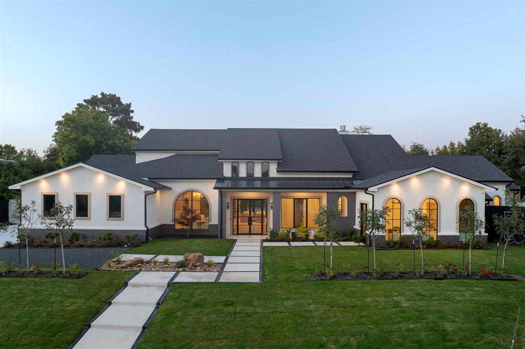 Experience modern elegance in the heart of Preston Hollow. This meticulously designed estate blends timeless style with everyday comfort, featuring four en-suite bedrooms, six baths, two stunning living areas, and dual full kitchens ideal for entertaining. The chef’s kitchen showcases Thermador appliances, a Hestan range, and a custom stone vent hood, complemented by a full secondary kitchen and butler’s pantry. Venetian plaster walls, soaring ceilings, designer lighting, and three statement fireplaces create a refined warmth throughout. Step outside to a resort-style backyard with a sparkling pool, fountains, outdoor kitchen, multiple lounge spaces, and a private sauna. Upstairs, over 1,000 square feet of flexible living space offers endless possibilities—media lounge, fitness studio, or guest retreat. Luxury, comfort, and design converge beautifully in this Preston Hollow masterpiece.