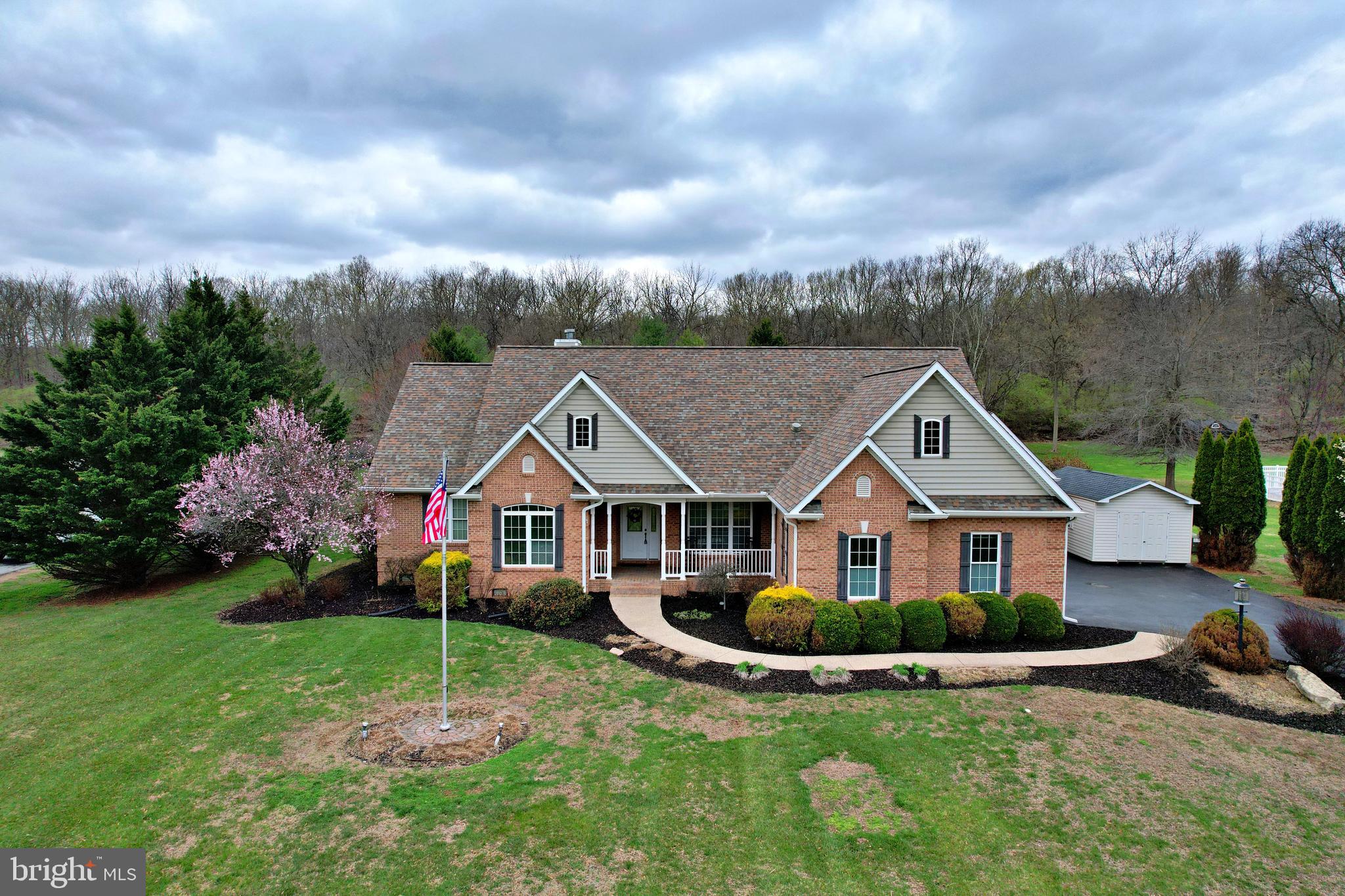 Stunning Custom Rancher on 2 Private Acres!This beautifully crafted 4-bedroom, 4-bath custom ranch home offers exceptional quality and thoughtful design throughout. The open-concept floor plan showcases elegant finishes, including Siltstone quartz countertops in the kitchen and radiant heated flooring for year-round comfort.Enjoy peaceful mornings or evening relaxation in the Italian tile sunroom, overlooking the gorgeous patio and pergola surrounded by lush landscaping and extensive hardscape. The spacious family room above the garage, complete with a convenient kitchenette, creates the perfect space for movie nights, entertaining guests.  Additional highlights include three fireplaces, custom built-ins, recessed lighting, chair rail detailing, upgraded countertops, skylights, and an intercom/security system. The finished lower level provides even more living and entertainment space with a pool table that conveys.Outside, the property continues to impress with a lighted, tree-lined driveway that accents the entrance to home, a waterfall feature with a coy pond, a large porch, and a storage shed, all set on 2 scenic acres. The home also features a 3-car garage, tankless hot water, central A/C /heat pumps, well and septic, and radiant heat powered by propane.  This one-of-a-kind property blends luxury, comfort, and privacy—a must-see!