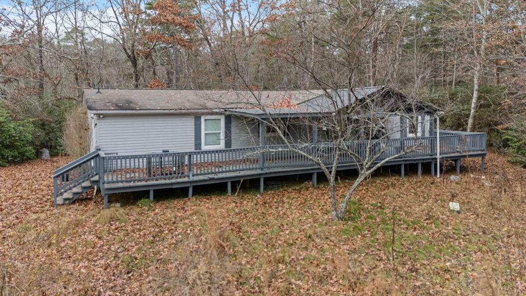 Move-in ready 3BR/2BA home on 4.68 acres in Warne, NC. This 1,623 sq ft property, built in 1998, features a well-maintained kitchen and bathrooms, good HVAC system, and roof in solid condition. Spacious lot offers privacy, usable land, and room for future additions. No garage, but ample parking available. Great opportunity for buyers seeking acreage and a comfortable, ready-to-go home.